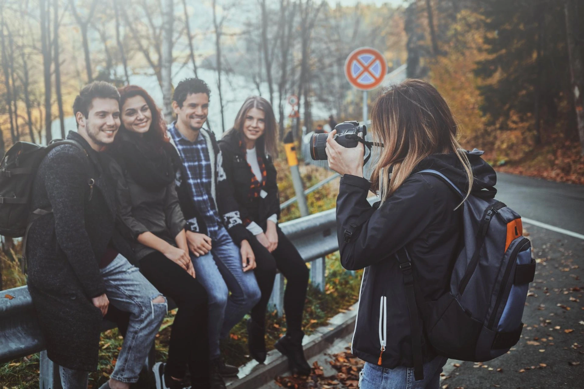 Friends posing for a travel photo during a scenic trip, highlighting social travel experiences in New Zealand vs Switzerland