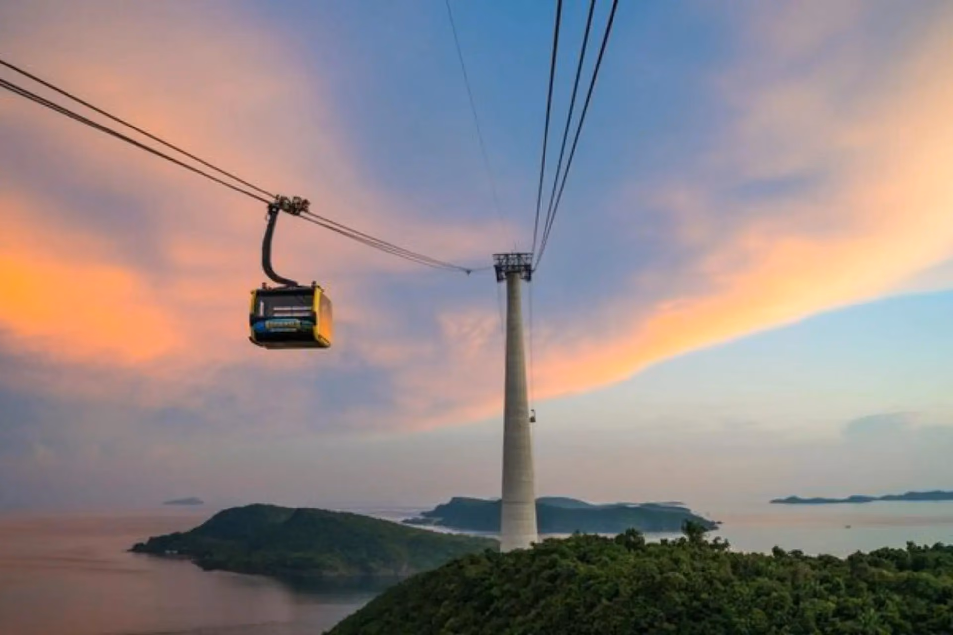 Cable car over islands and water at sunset Vietnam