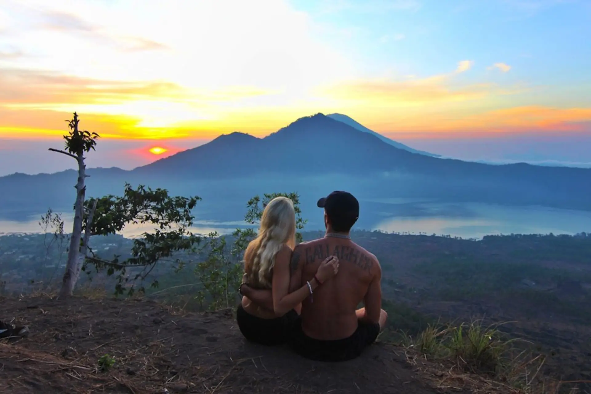 Couple watching sunset over Mount Agung Bali