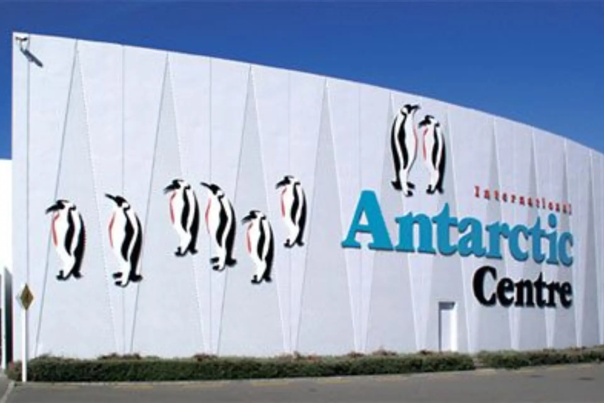 Antarctic Centre building with penguin drawings on white wall