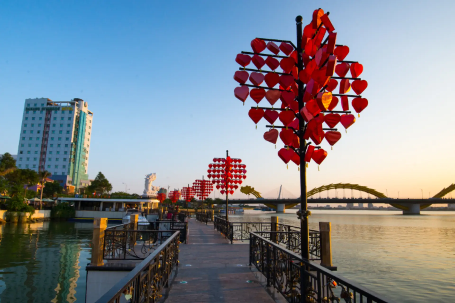Red heart decorations on pole at Da Nang bridge