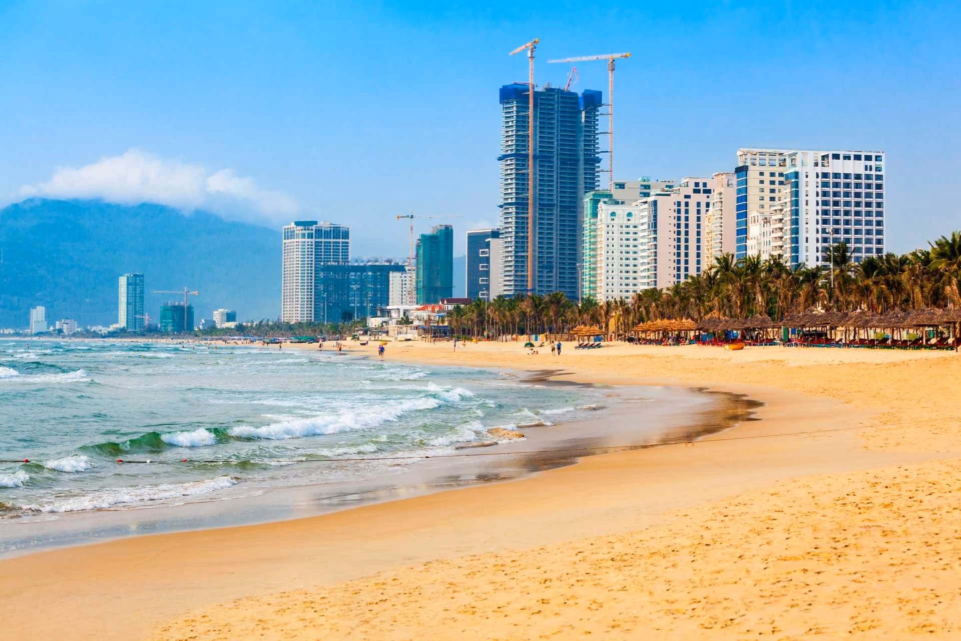 My Khe Beach with high-rise buildings and palm trees