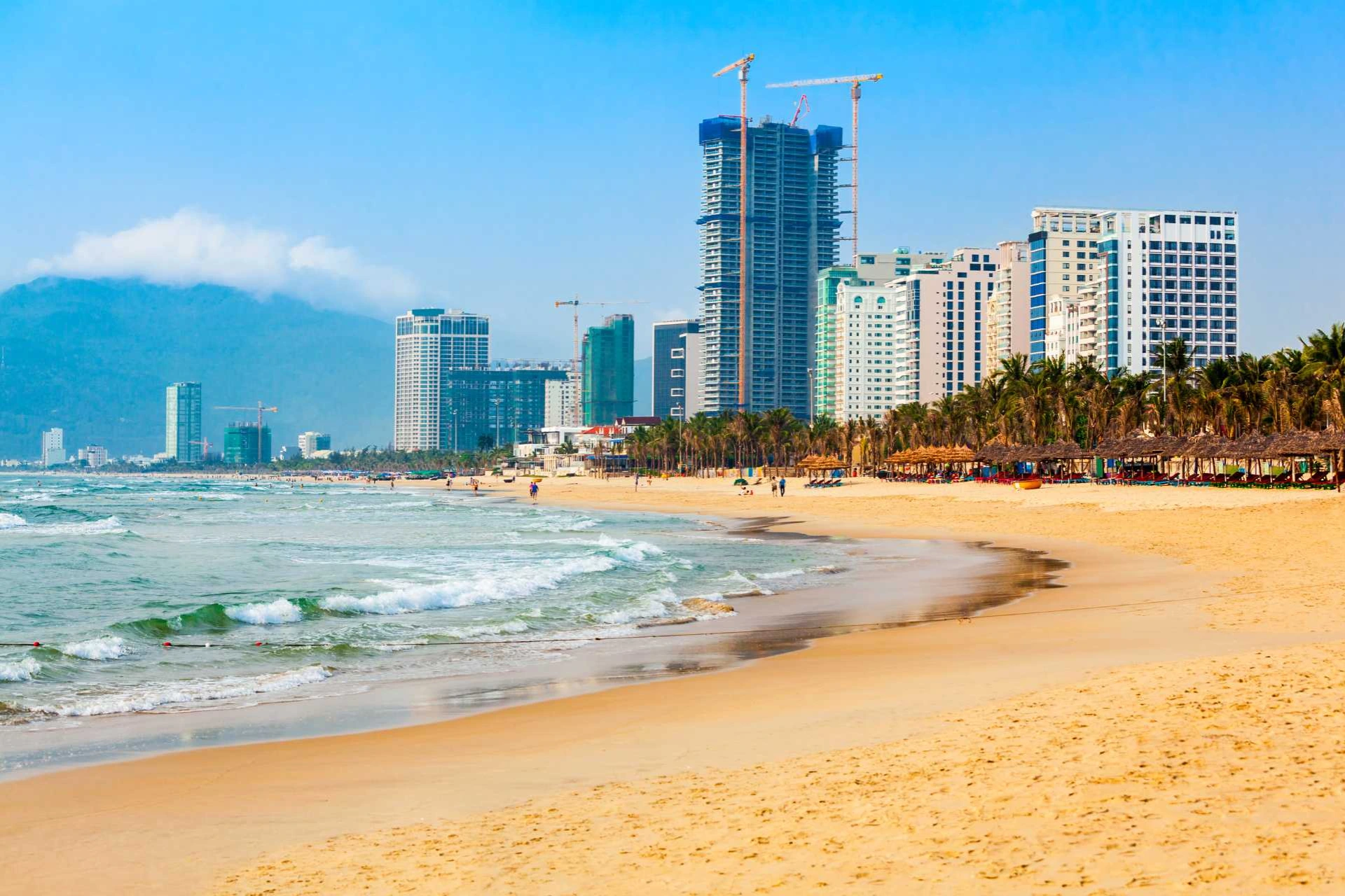 My Khe Beach with high-rise buildings and palm trees