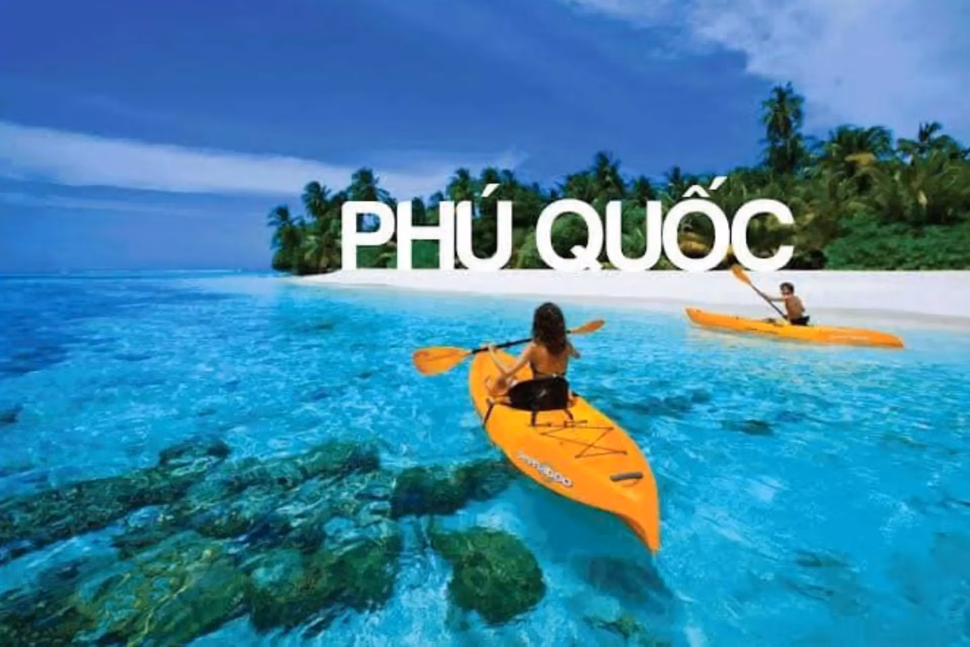 Kayakers paddling in clear blue water off Phu Quoc island