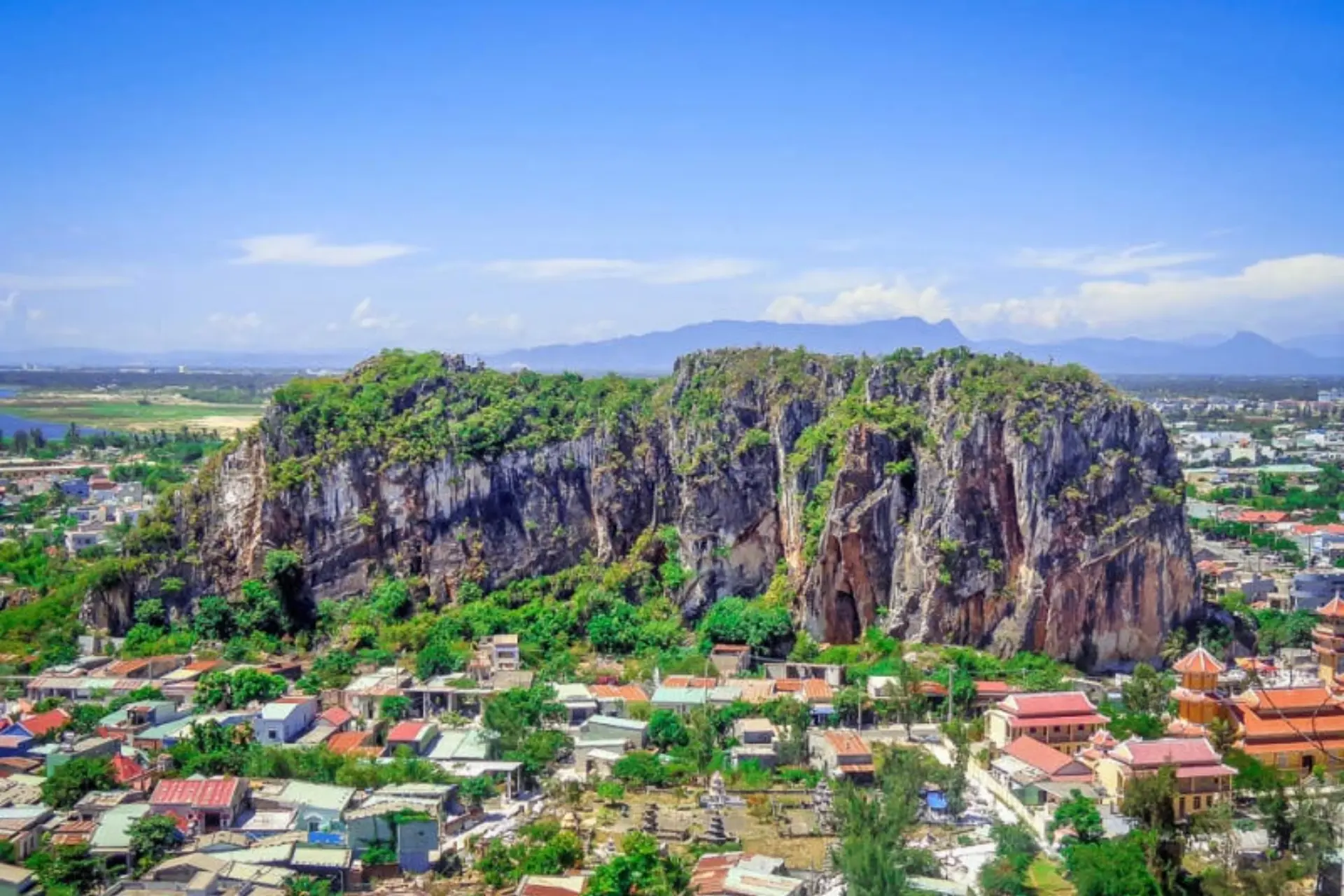 Marble Mountains rocky peaks above Da Nang town below
