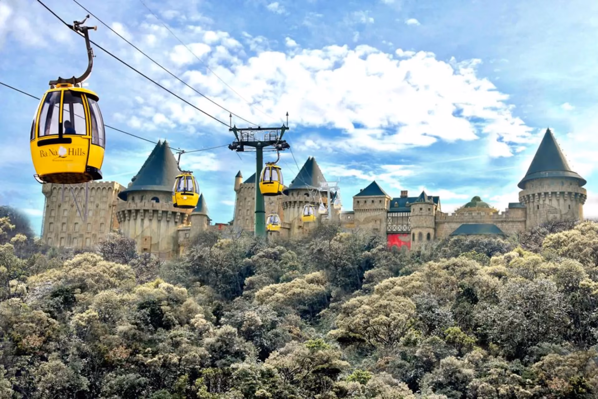 Yellow cable cars above castle towers in Da Nang Vietnam
