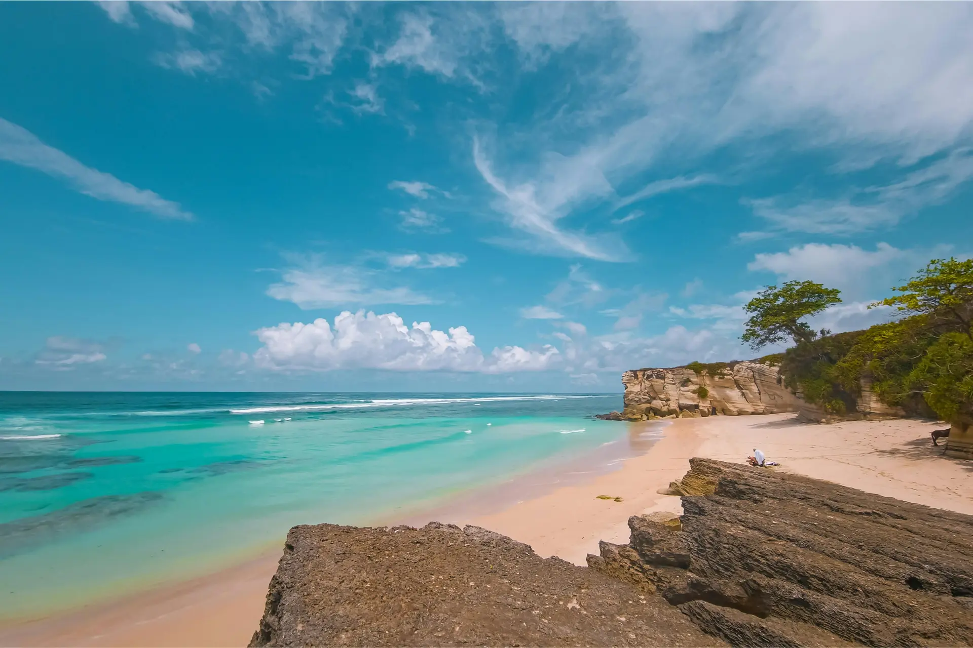 Pandawa Beach with clear blue water and rocky cliffs