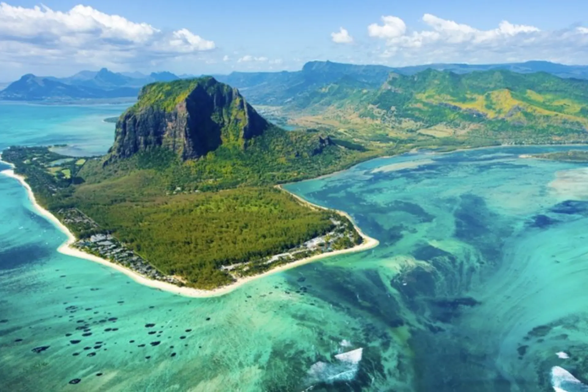 Le Morne Brabant mountain rising from blue-green water, Mauritius
