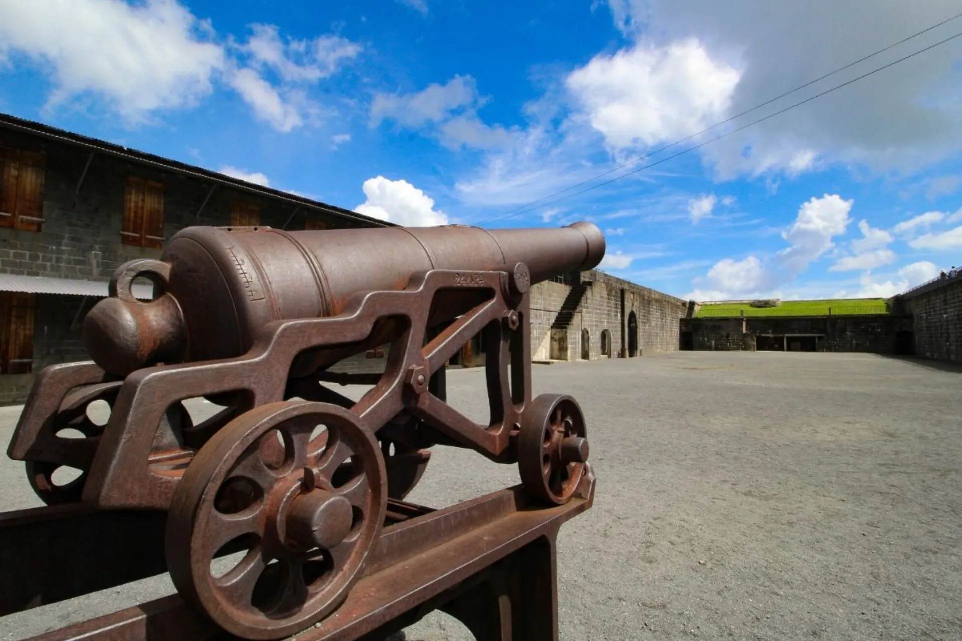 Rusty cannon at fortress in Mauritius courtyard