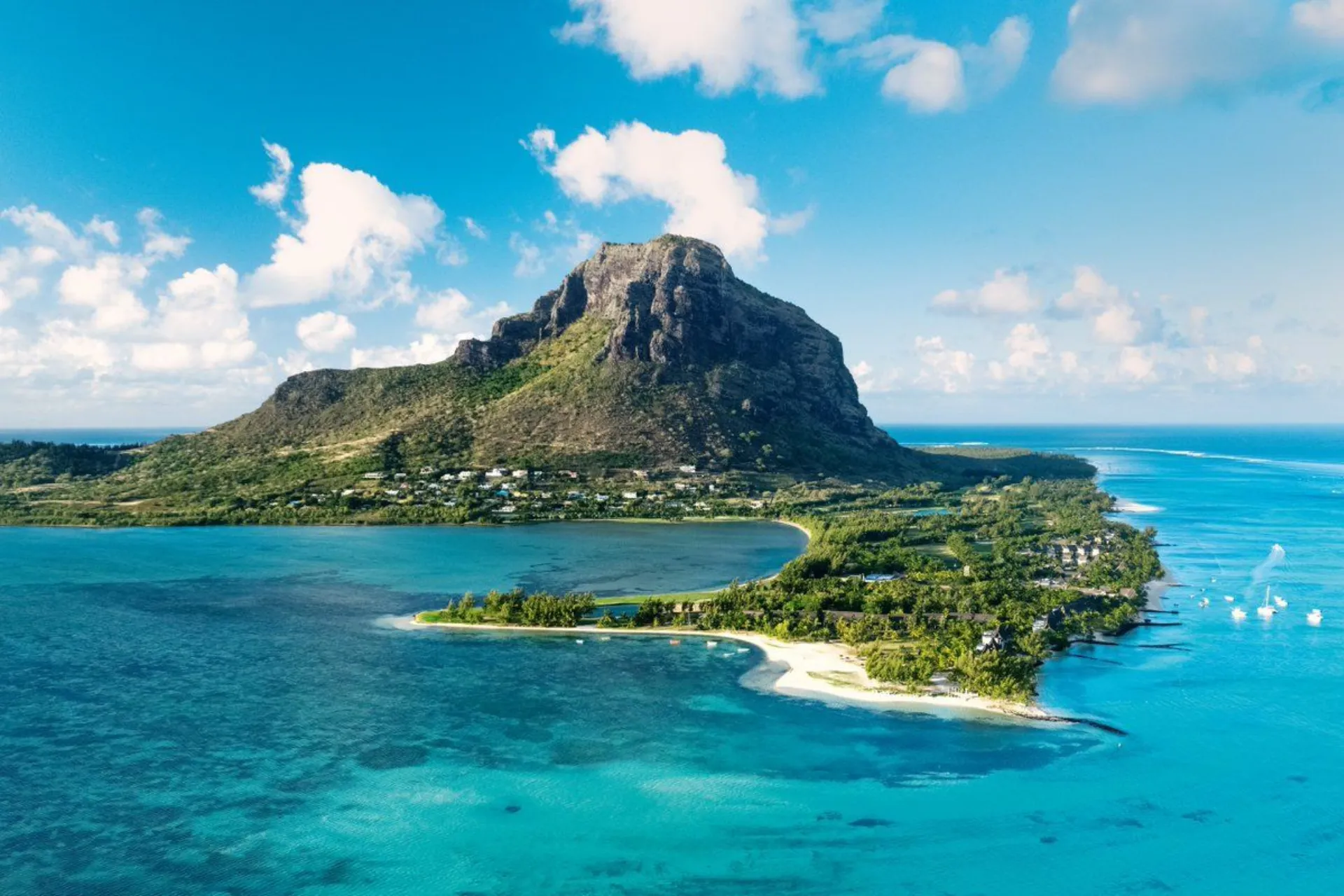 Mauritius island with mountain, beach, and blue water