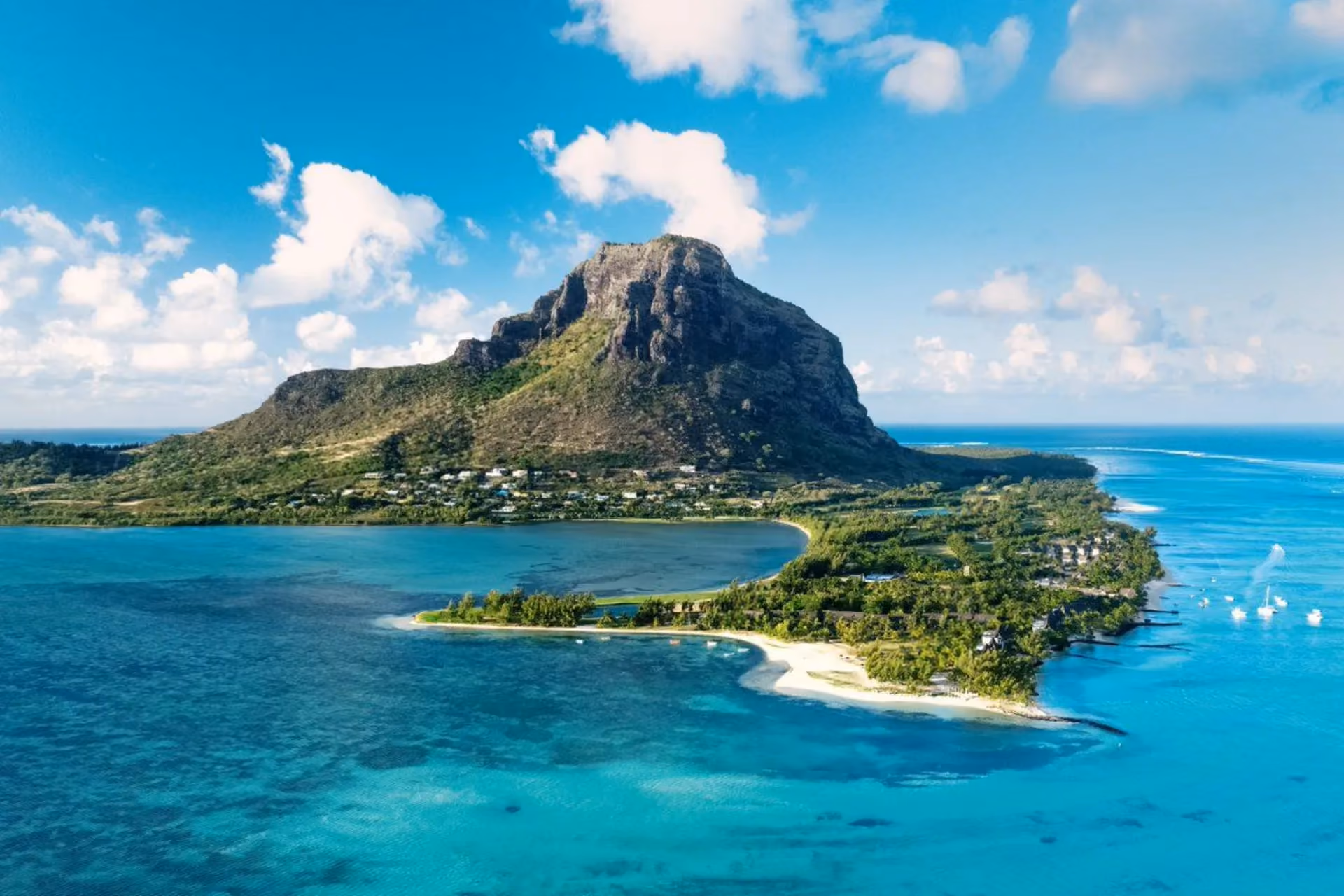 Mauritius island with mountain, beach, and blue water