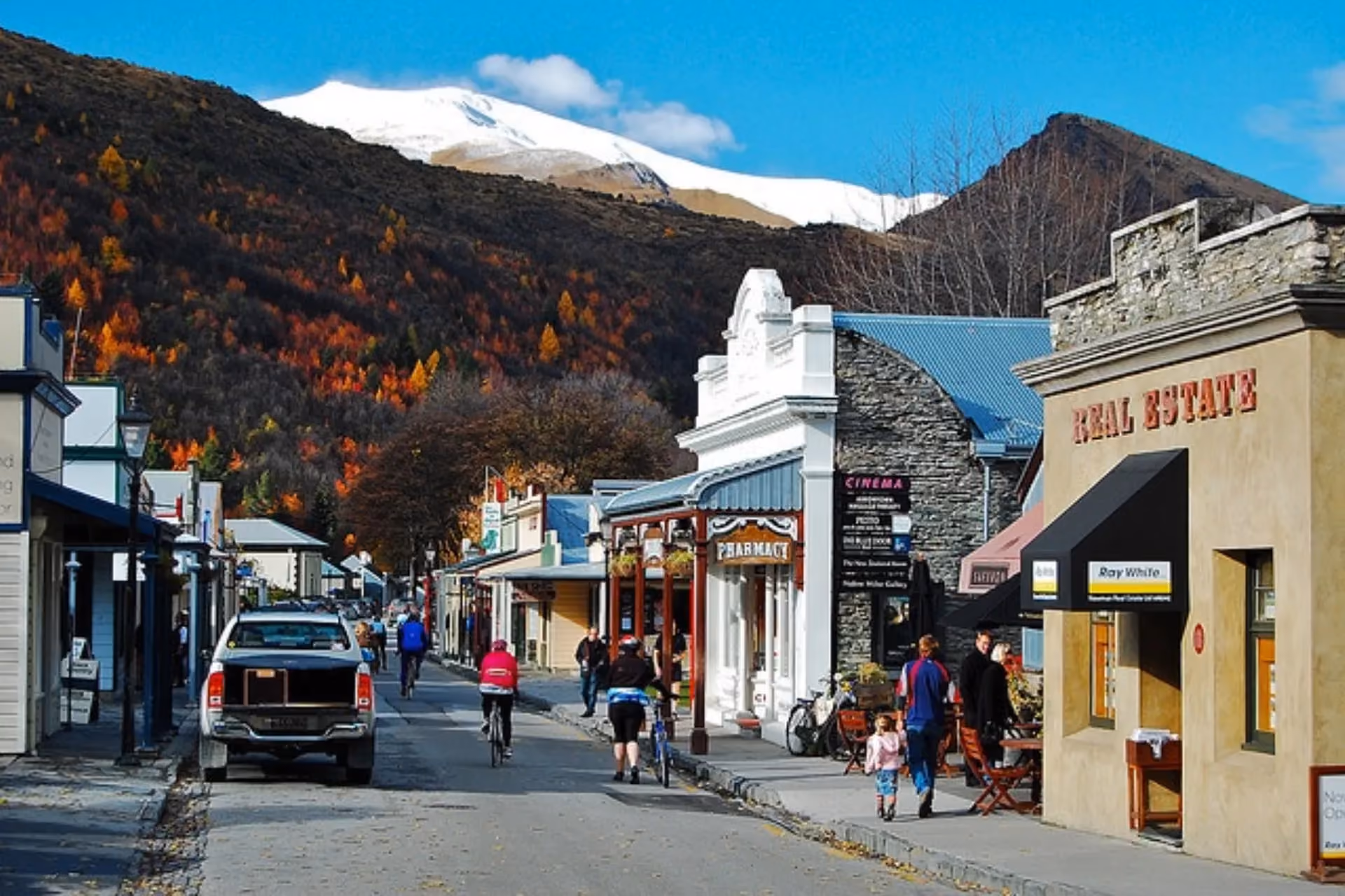 Arrowtown main street with snow-capped mountain behind
