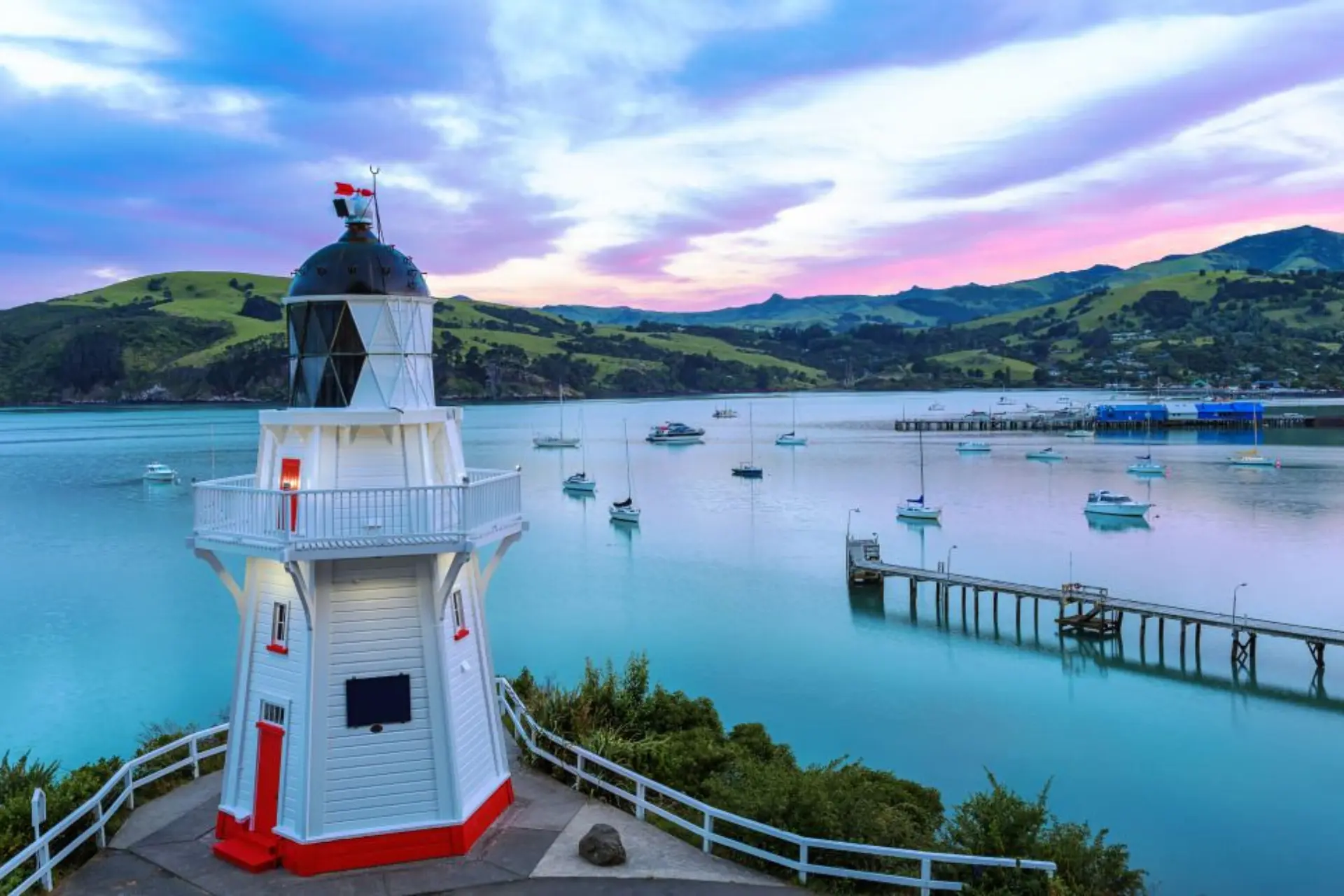 Red and white lighthouse at Akaroa harbor, New Zealand