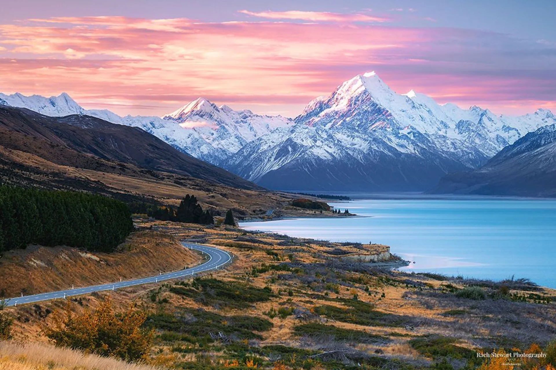 Snow-capped mountain and blue lake in New Zealand