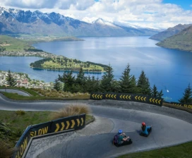 Gondola ride over lake and mountains in New Zealand
