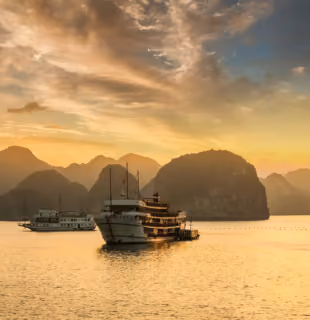 Boat in Halong Bay at sunset