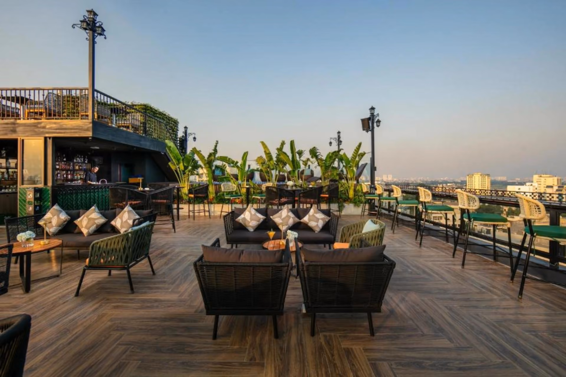 May De Ville Corner rooftop lounge with city views and seating