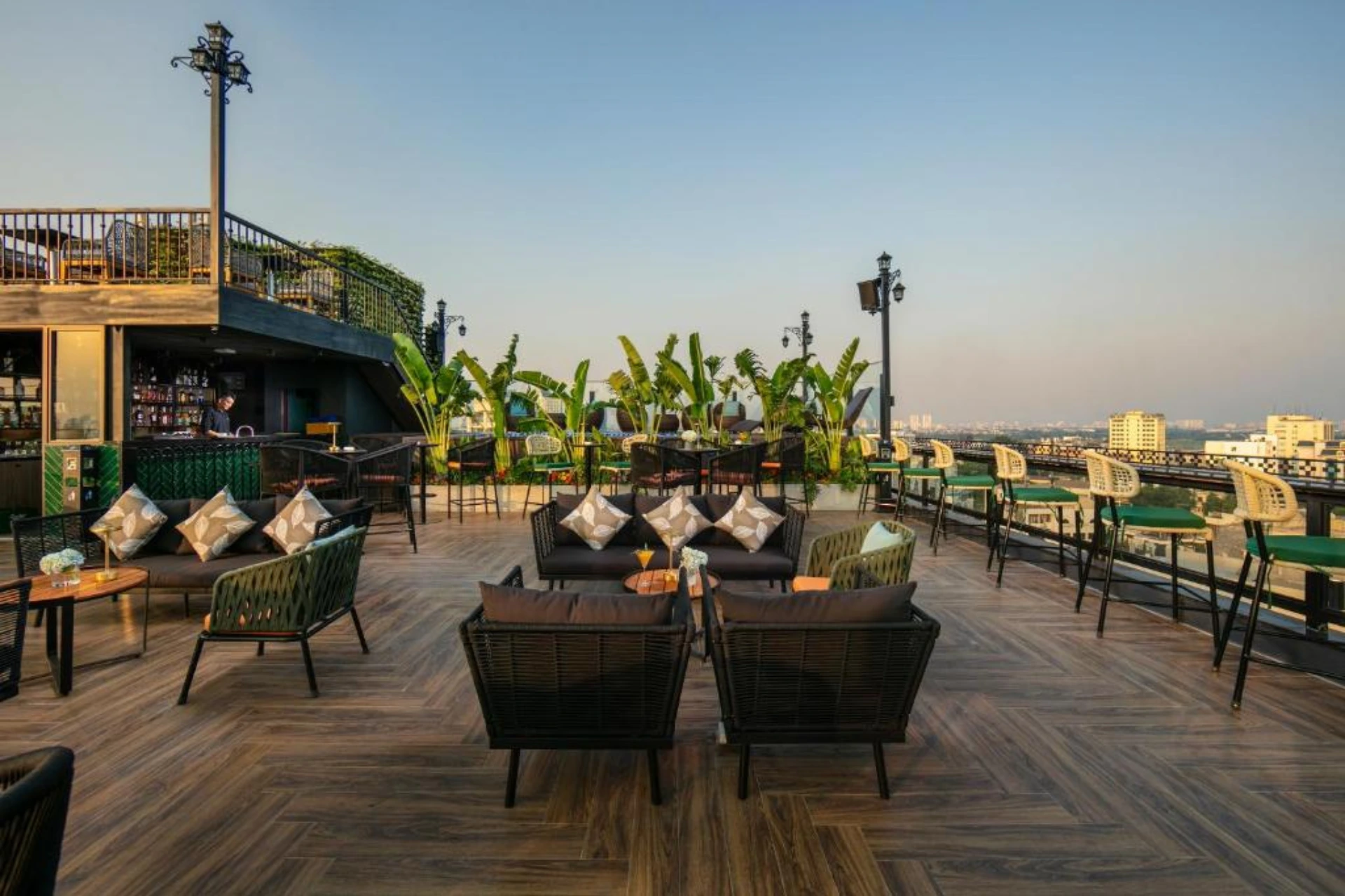 May De Ville Corner rooftop lounge with city views and seating