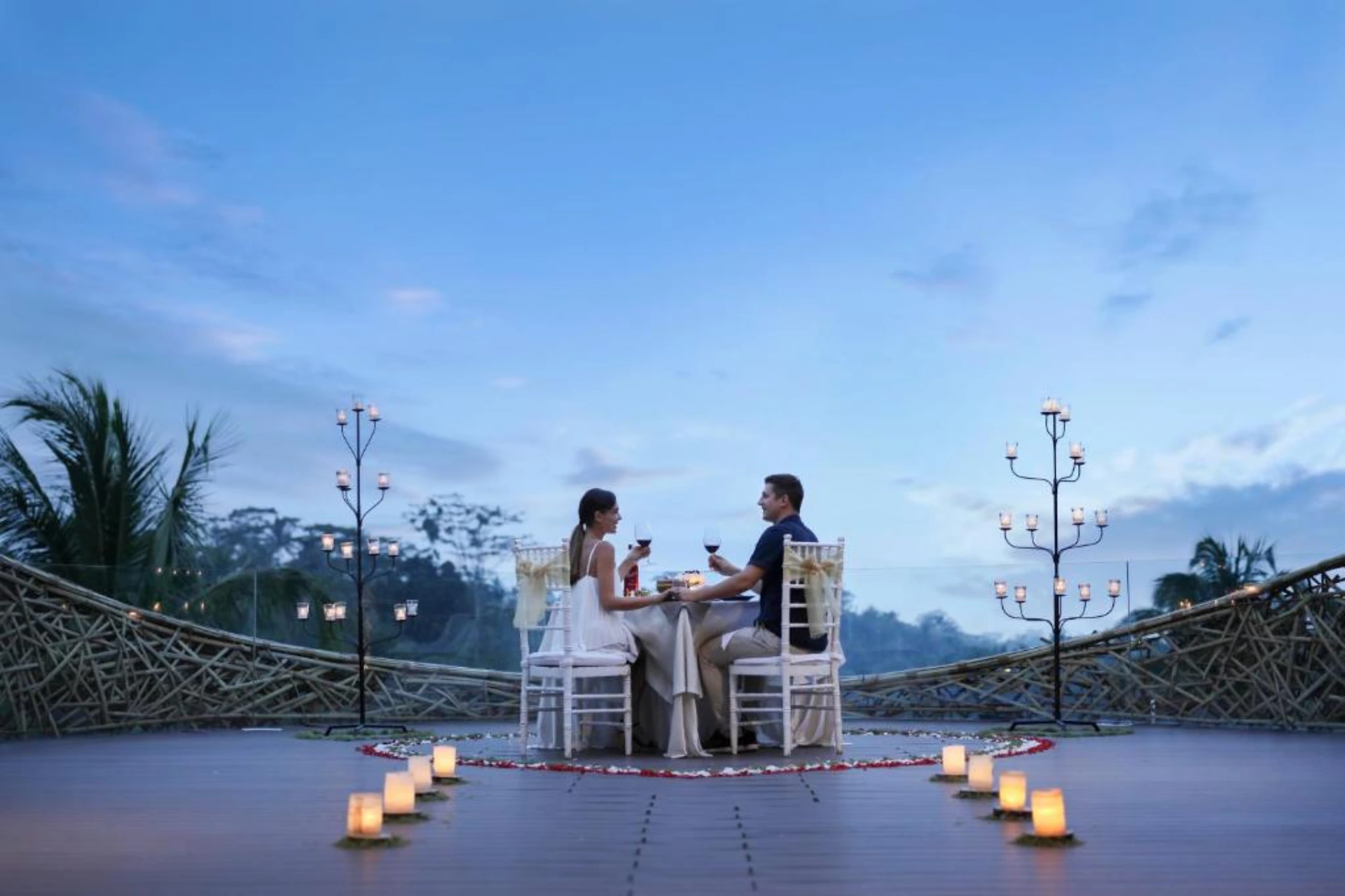 Couple dining at candlelit table, Padma Resort Ubud
