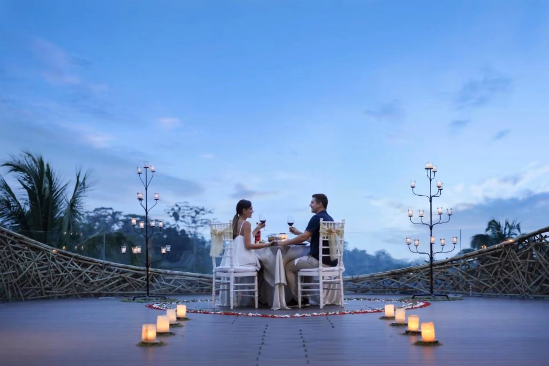Couple dining at candlelit table, Padma Resort Ubud