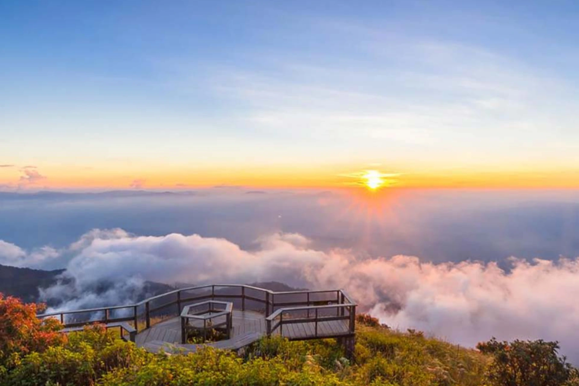 Wooden deck overlooking clouds at Doi Inthanon sunrise