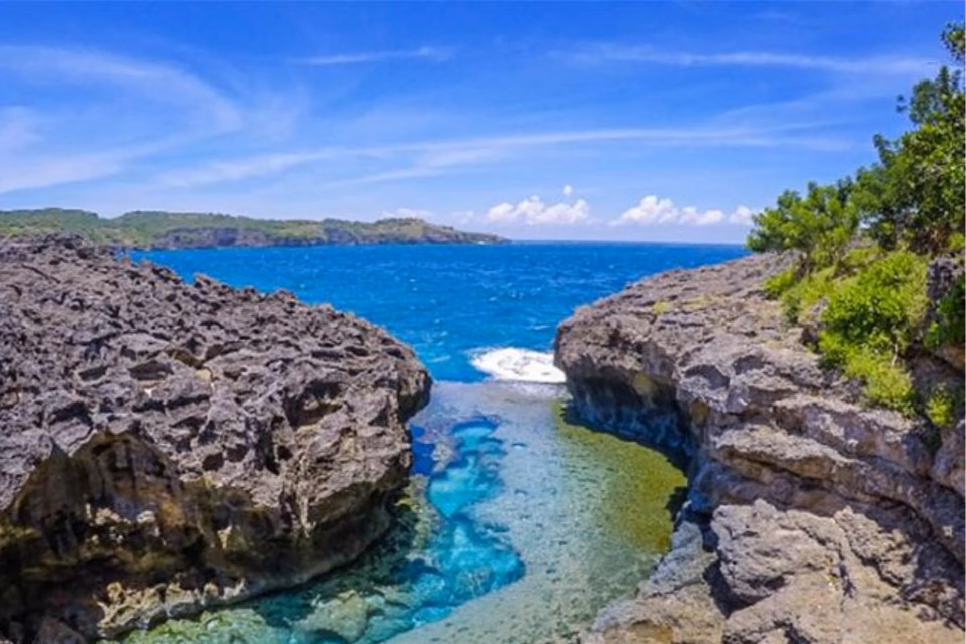 Clear blue water between rock cliffs at Angels Billabong