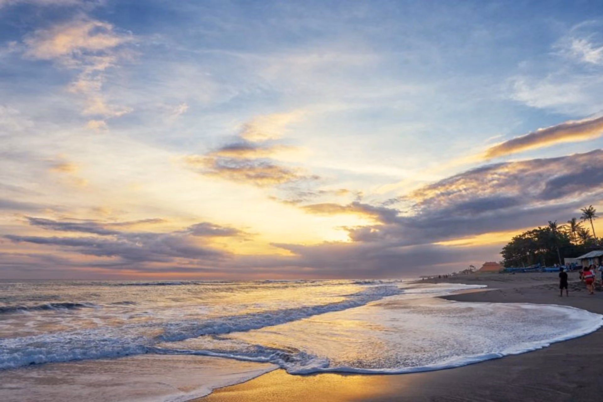 Sunset over beach and ocean at Seminyak Bali