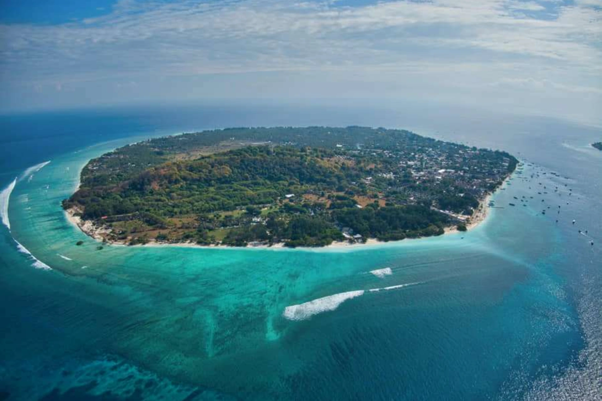 Gili Trawangan island surrounded by blue-green water and white sand