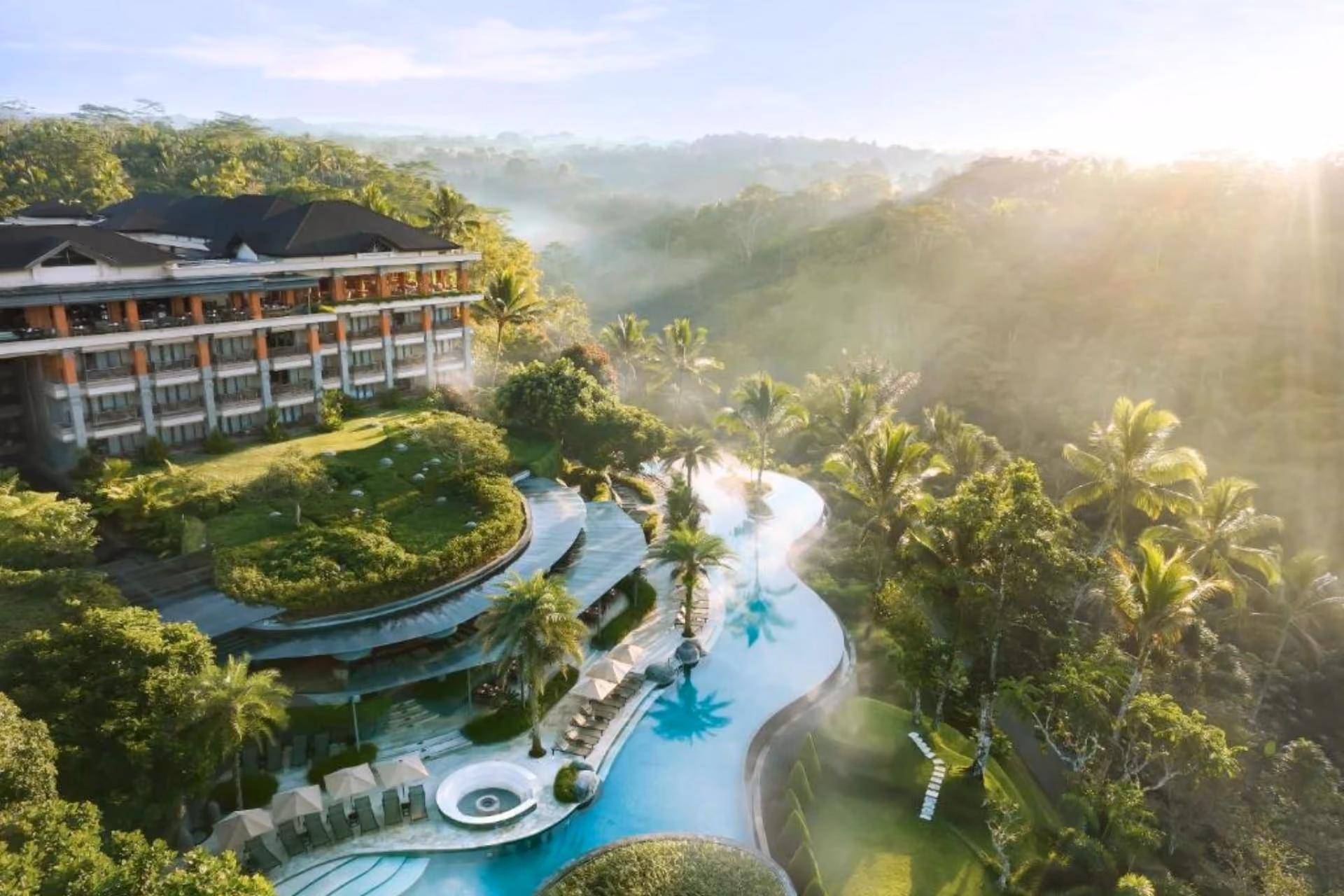 Padma Resort Ubud pool surrounded by green forest valley