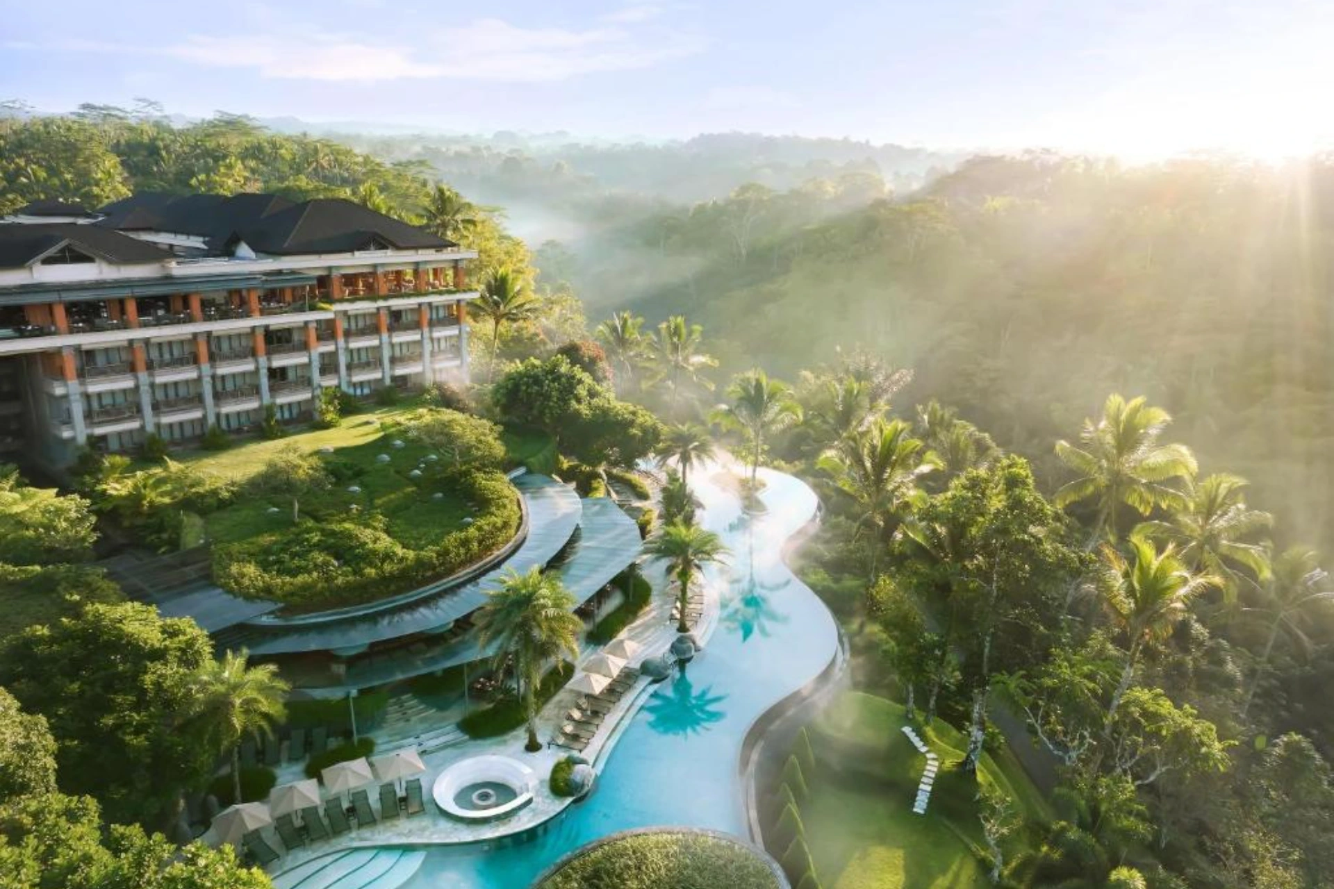 Padma Resort Ubud pool surrounded by green forest valley