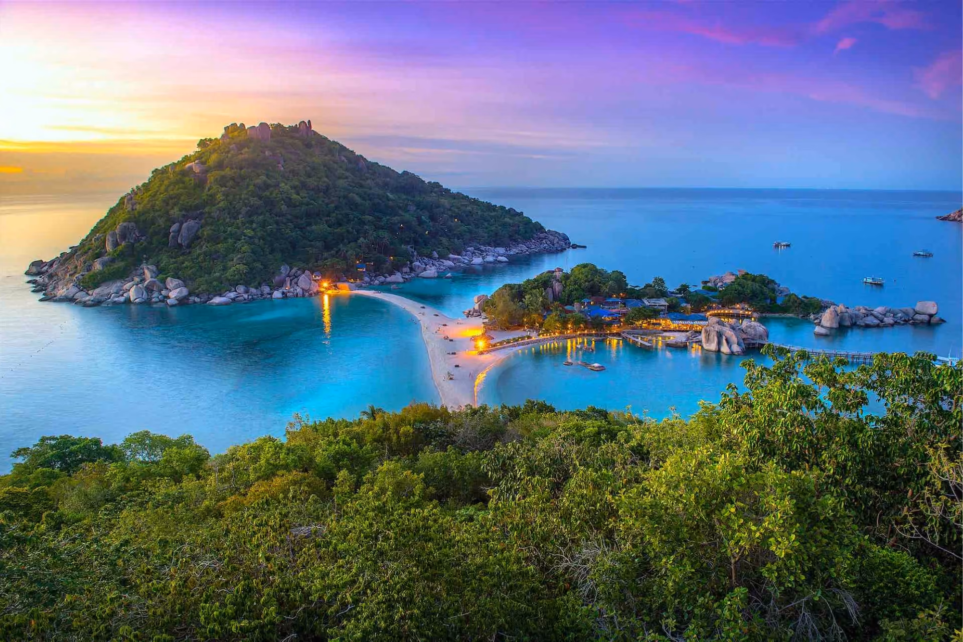 Sunset view of rocky island and beach at Koh Tao Thailand