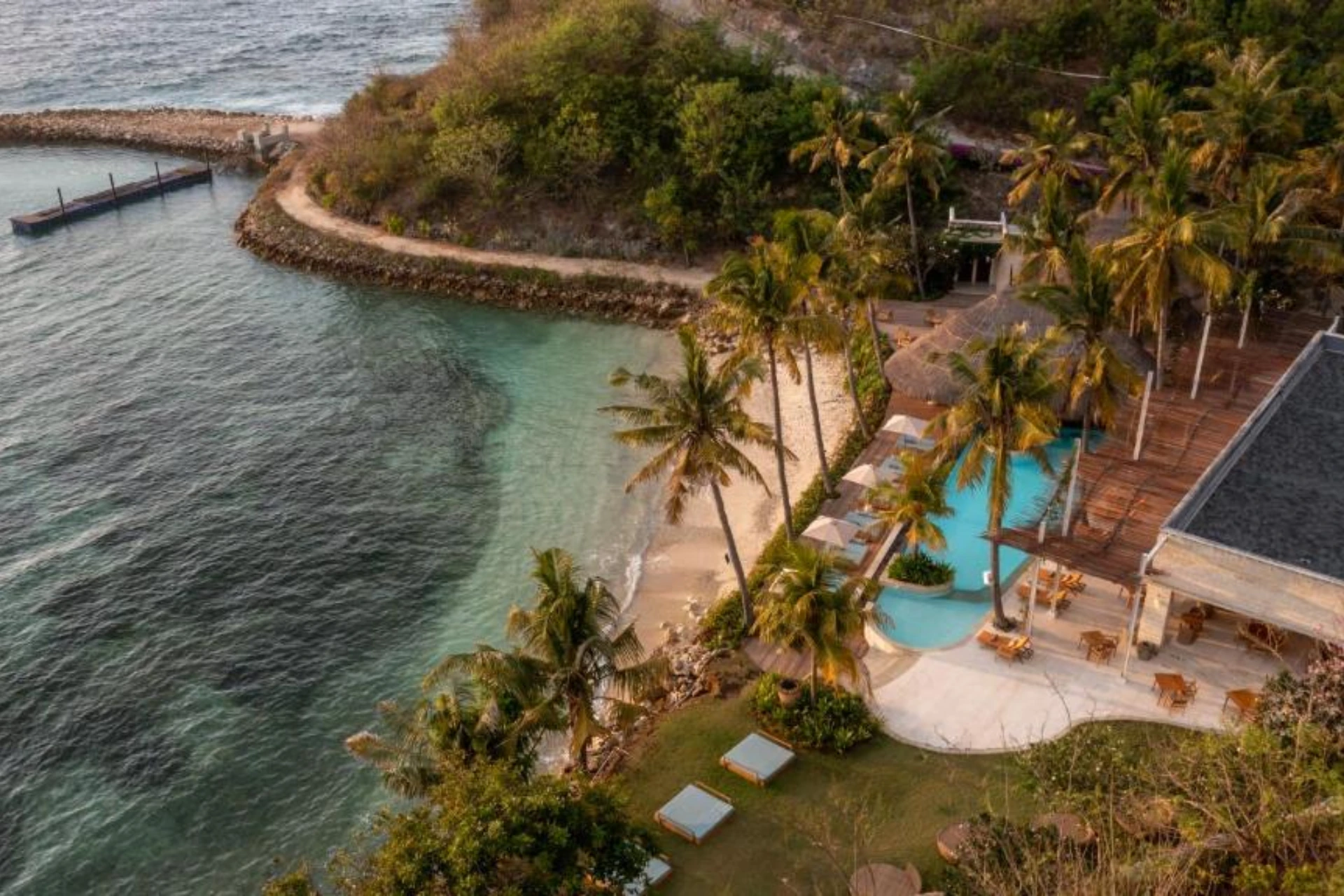 Semaya Beach with pool, palm trees, and calm water