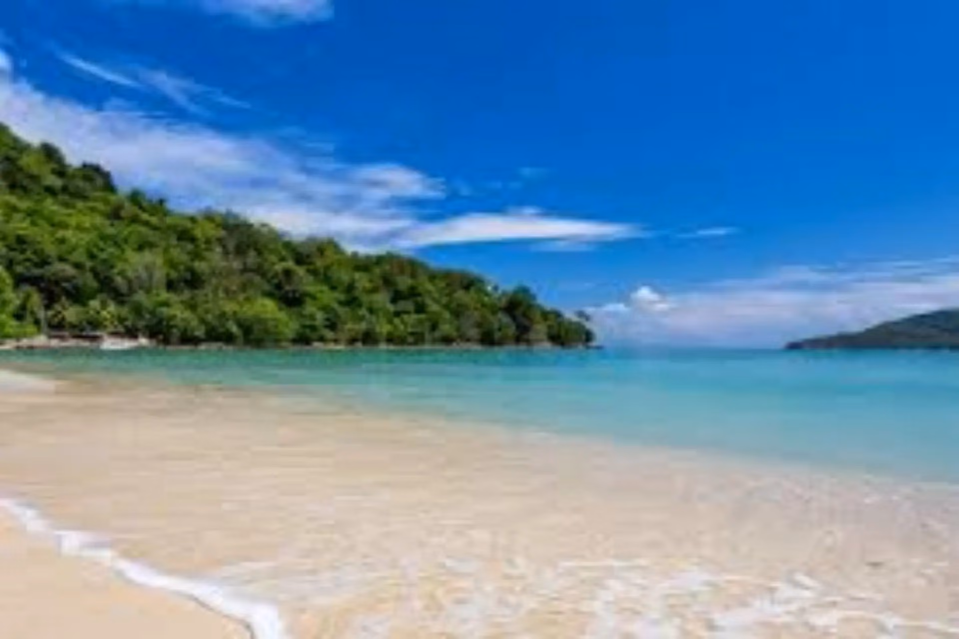Clear blue water and sandy beach at Phuket