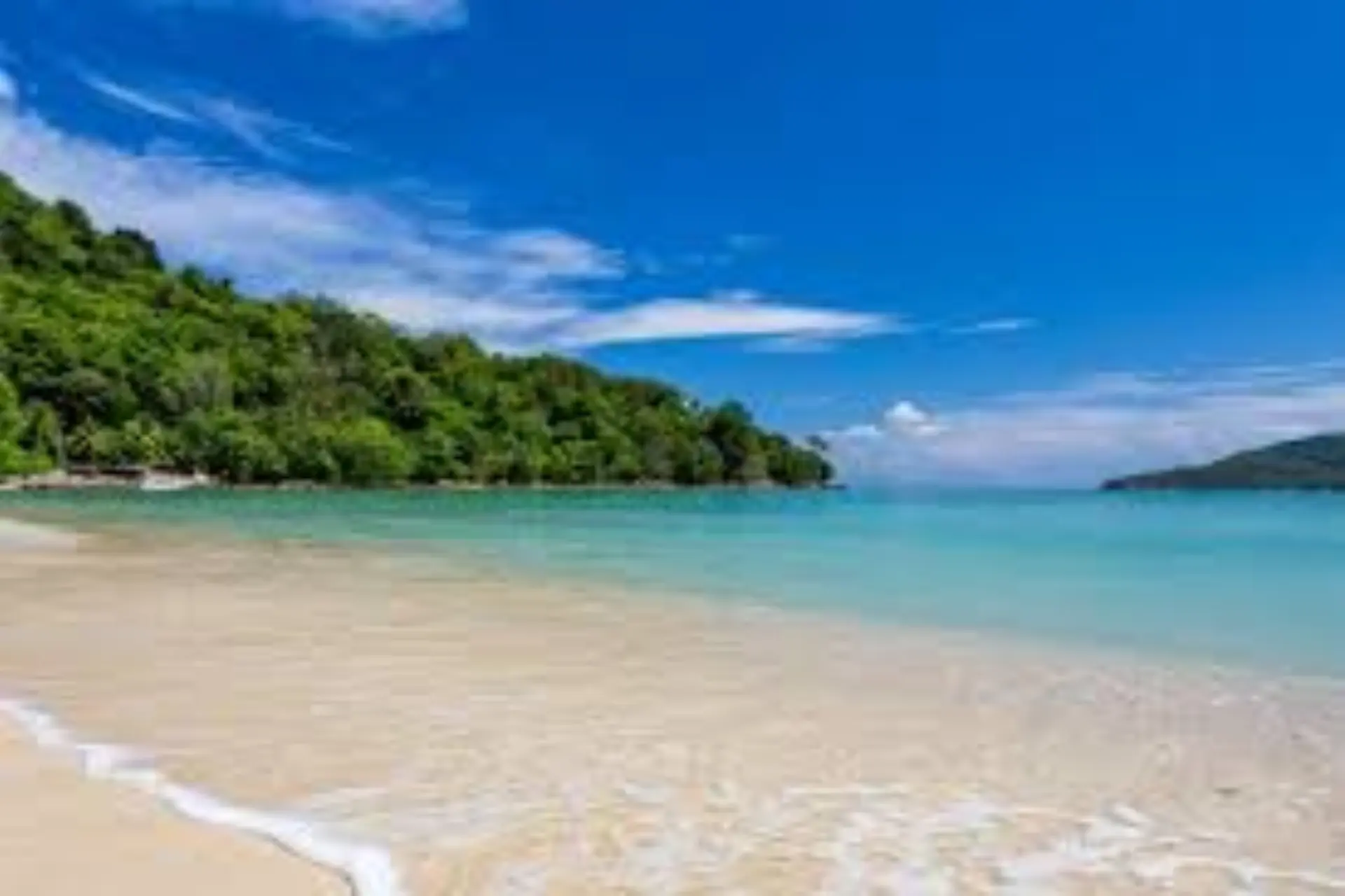 Clear blue water and sandy beach at Phuket