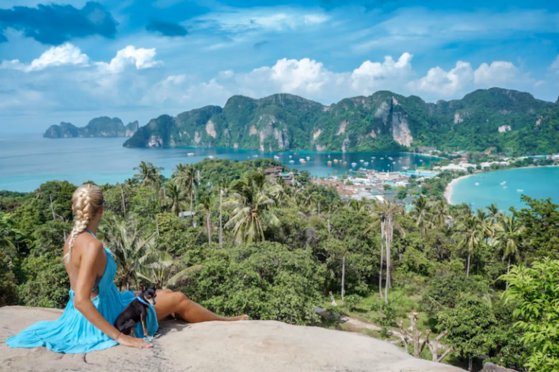 Woman in blue dress overlooking Phi Phi Islands bay
