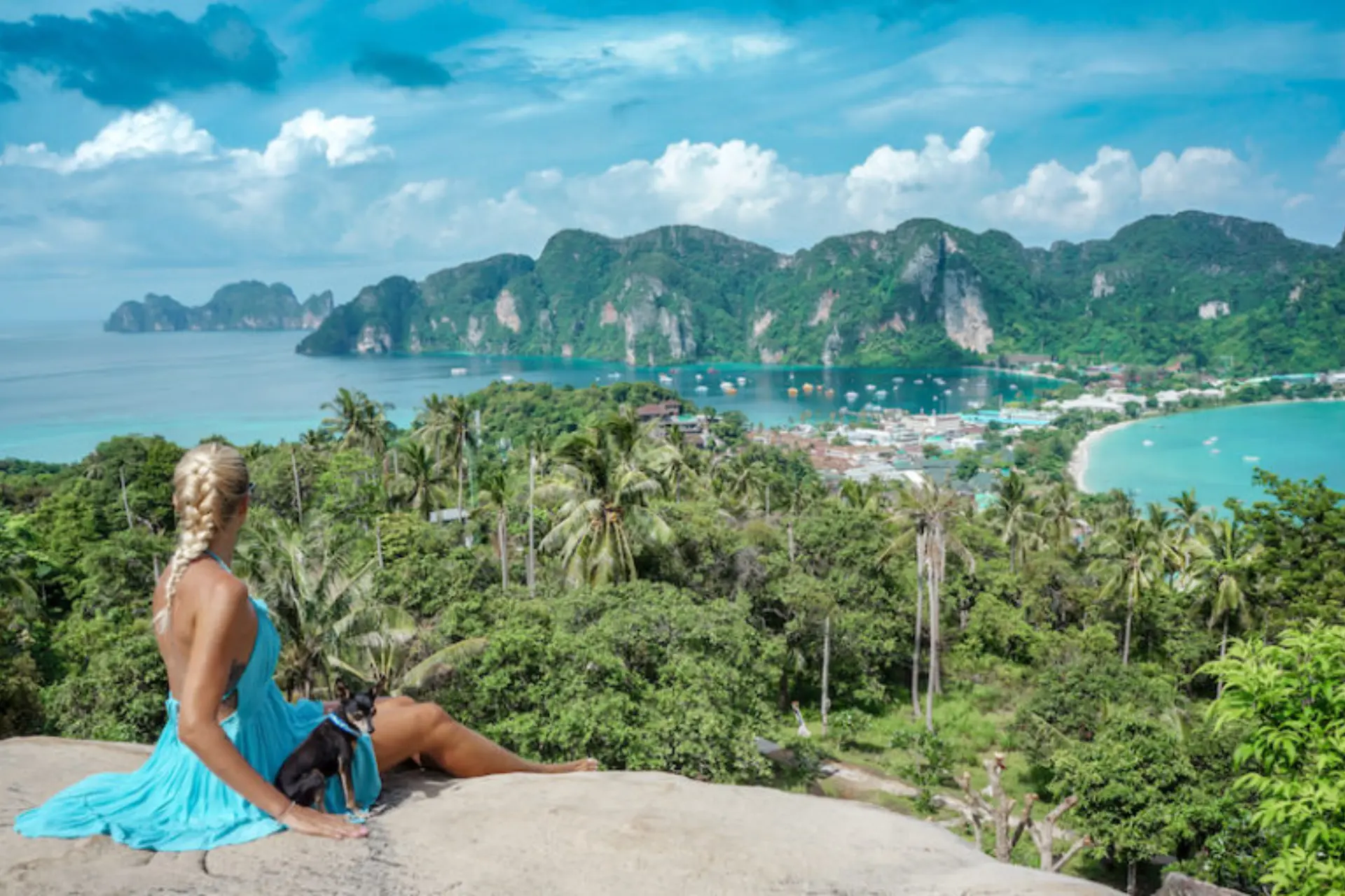Woman in blue dress overlooking Phi Phi Islands bay