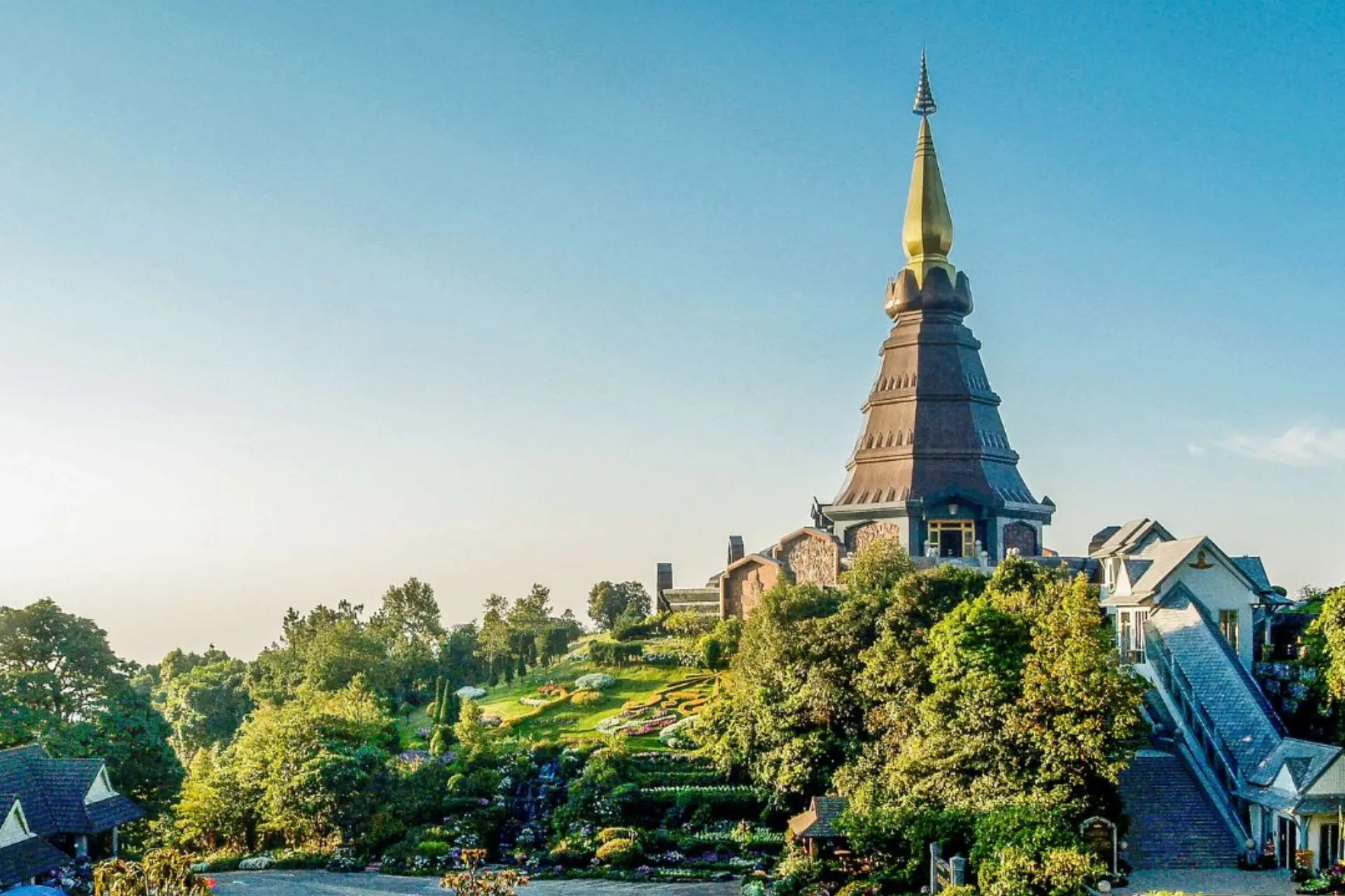 Tall golden temple on green hill at Doi Inthanon Thailand