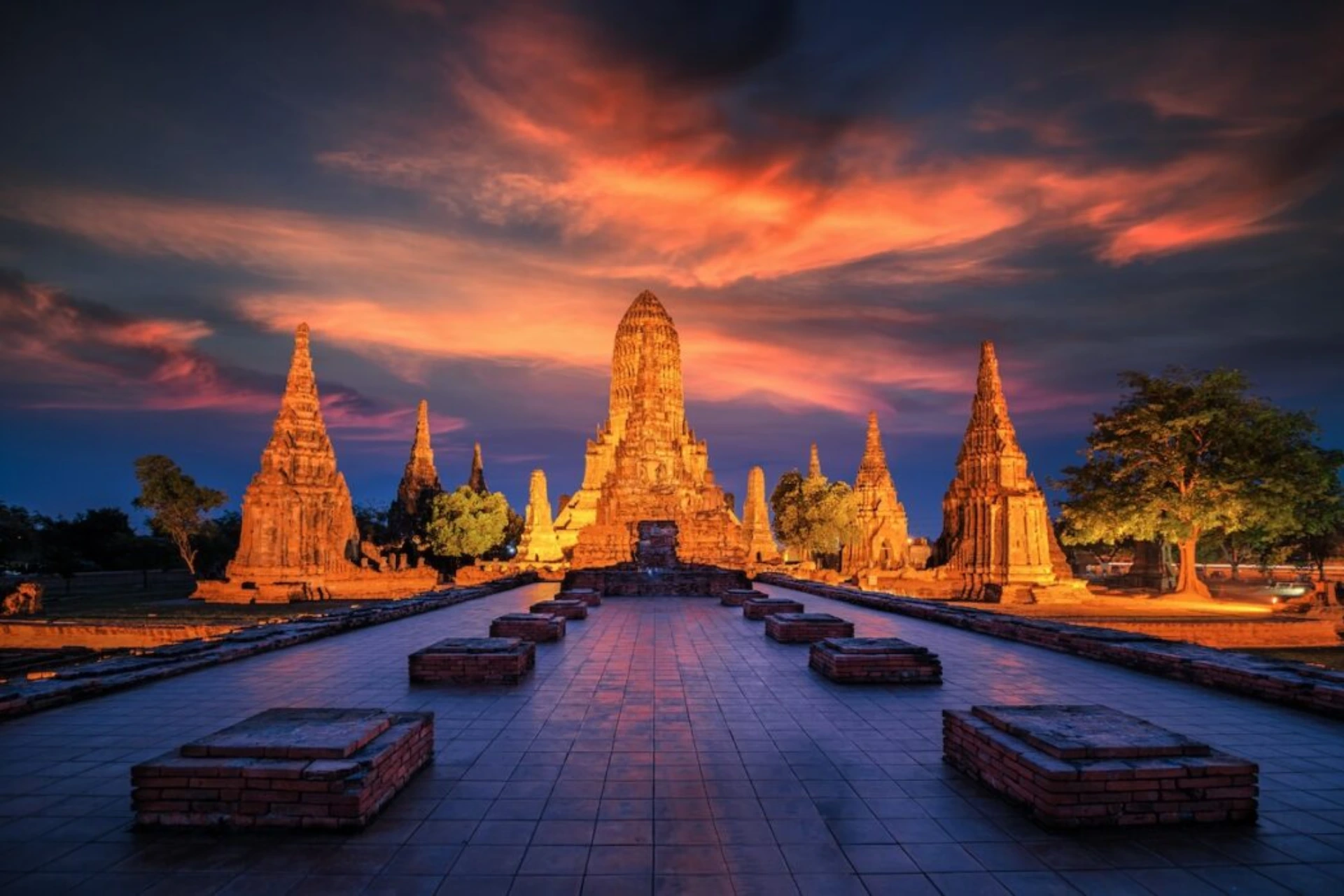 Thai temples lit up at sunset in Krabi