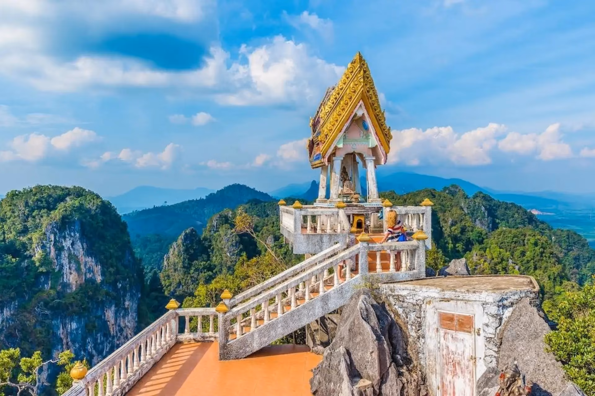 Thai temple on rocky cliff in Krabi mountains