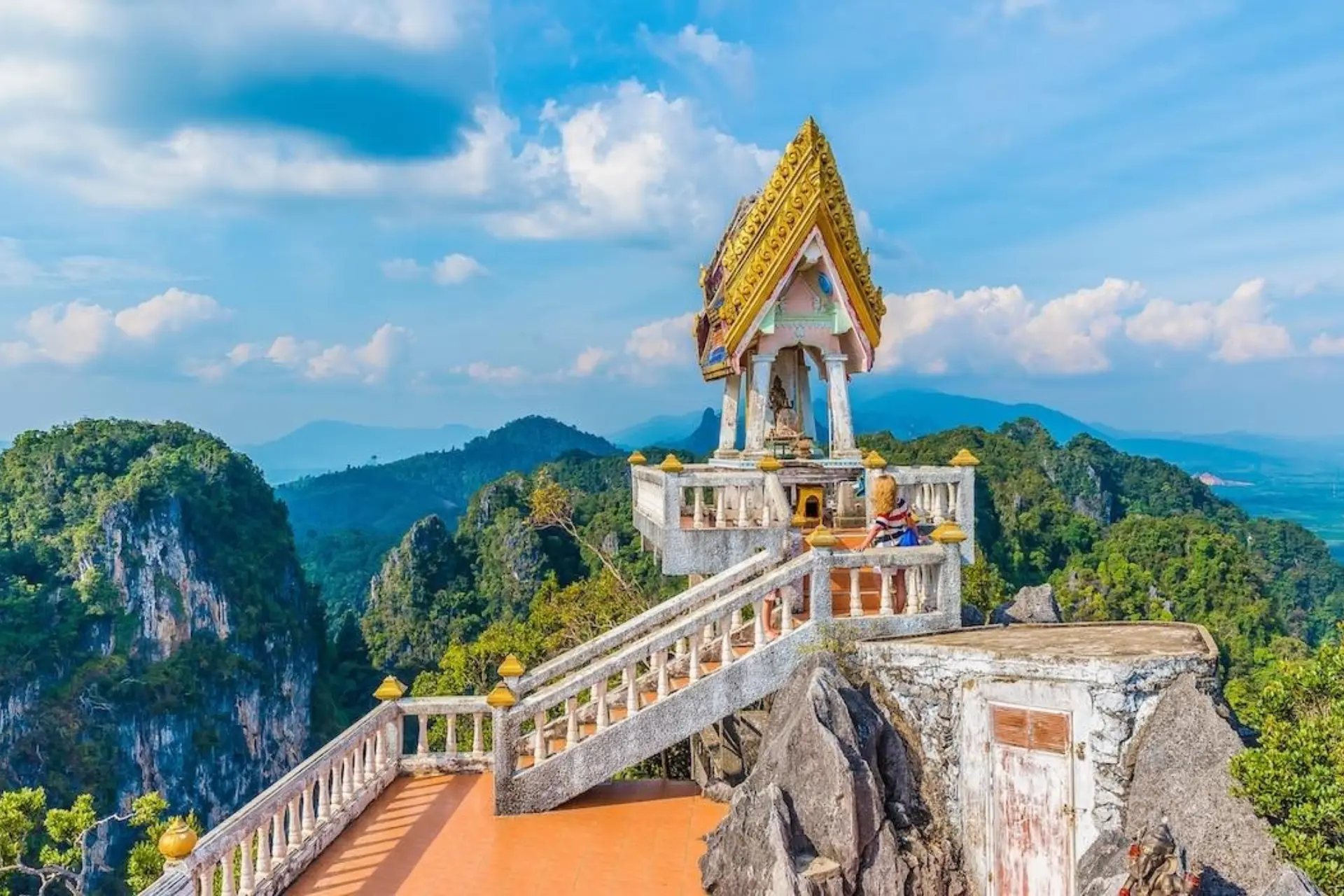 Thai temple on rocky cliff in Krabi mountains