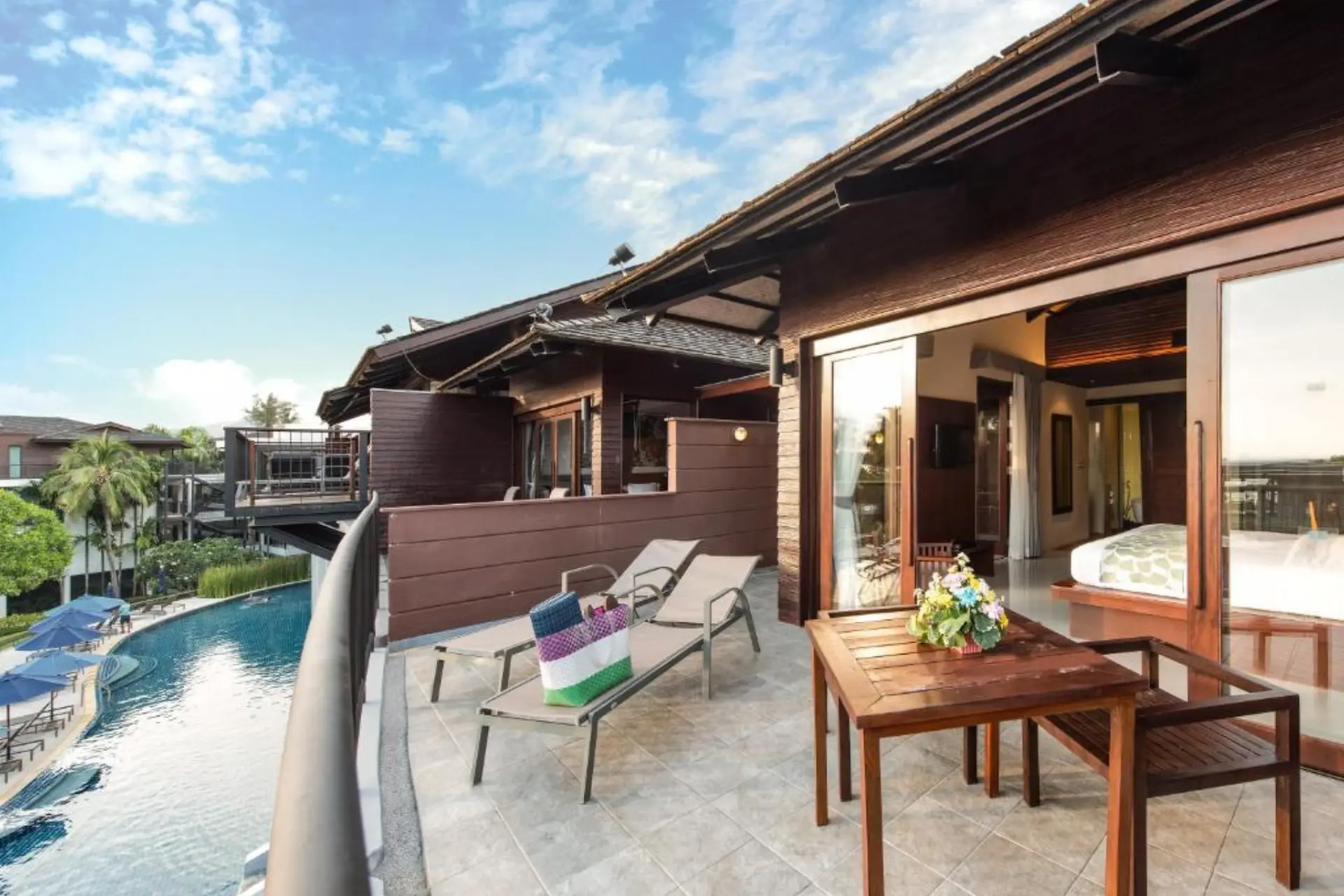 Ao Nang resort room with pool view and wooden deck