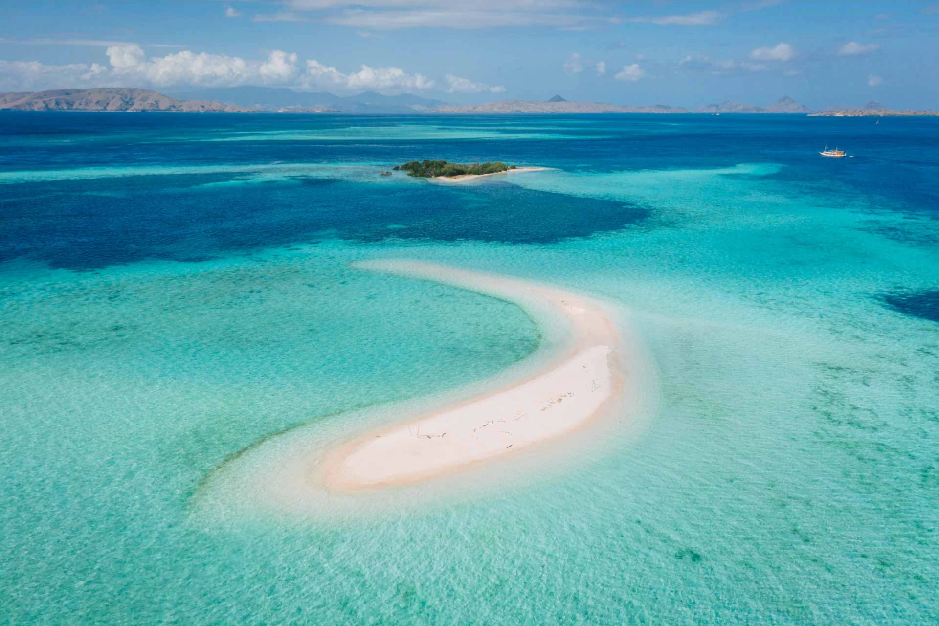 Taka Makassar sandbar with clear blue water and small island
