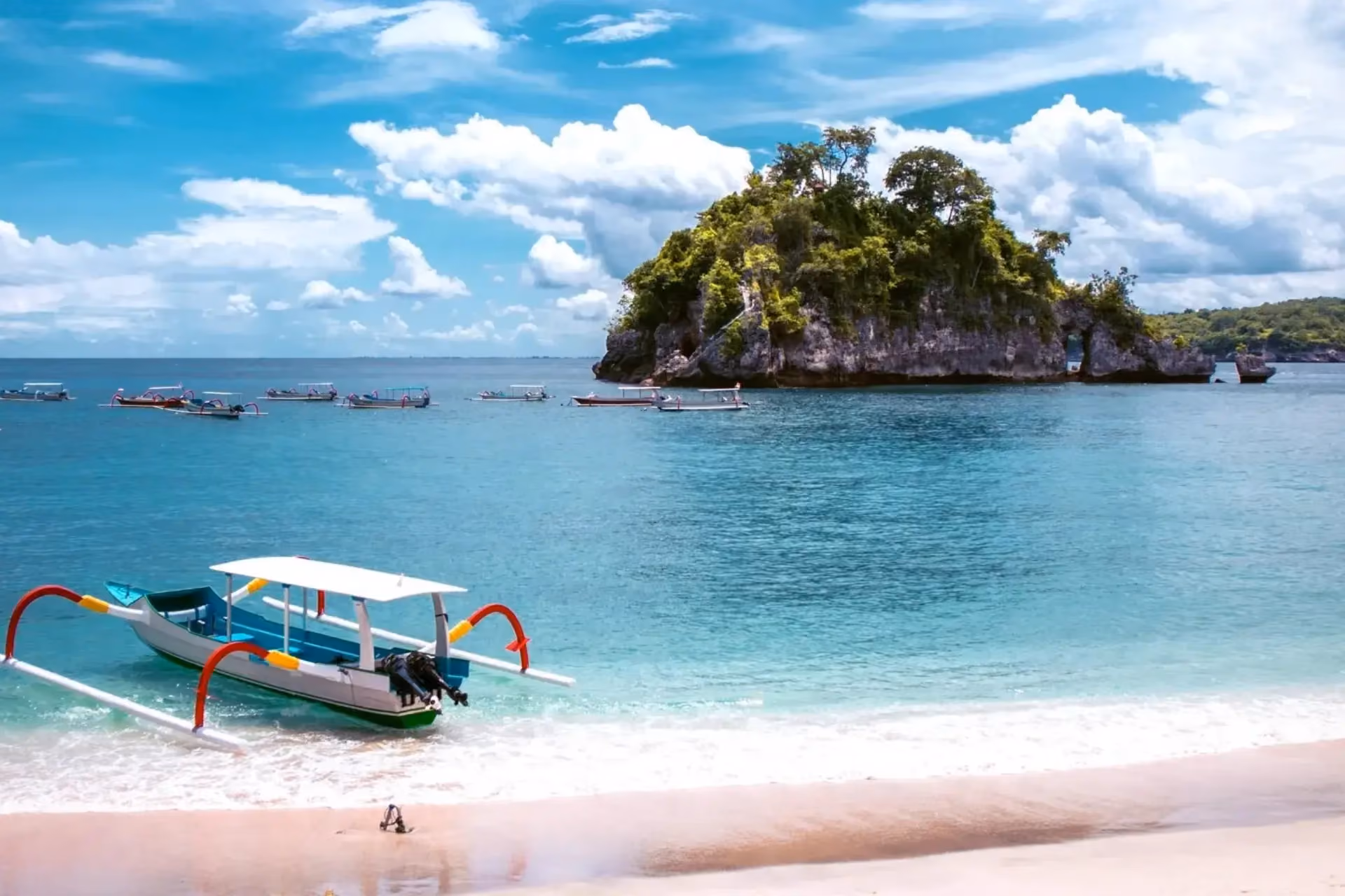 Colorful fishing boat in shallow water at Crystal Bay