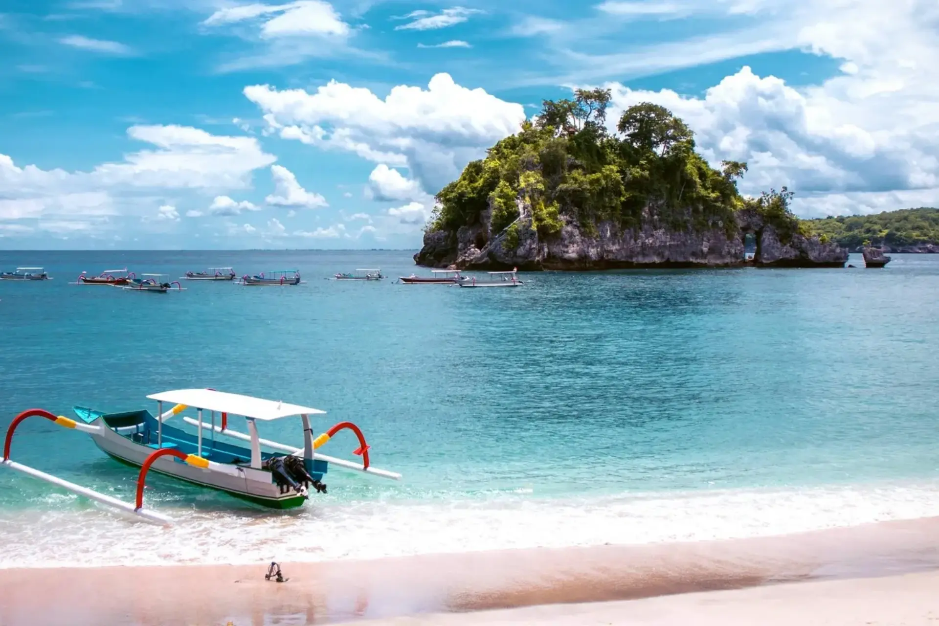 Colorful fishing boat in shallow water at Crystal Bay