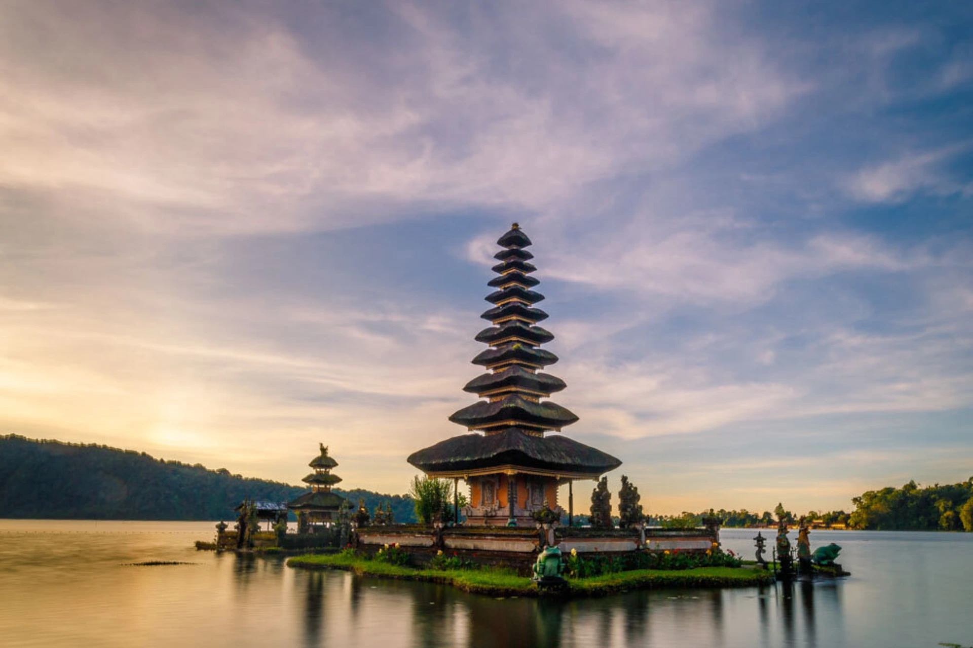 Ulun Danu Temple on island in lake at sunset