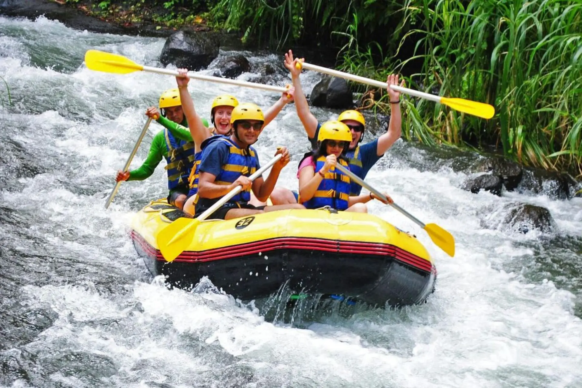 Group white water rafting in Bali river rapids