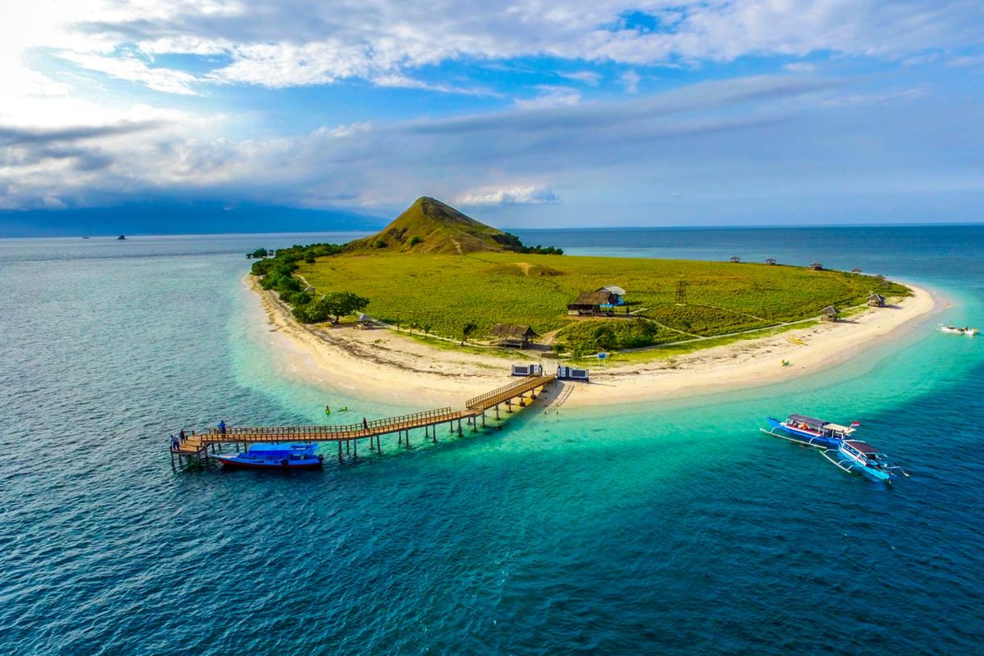Green island with beach and boats, Lombok Indonesia
