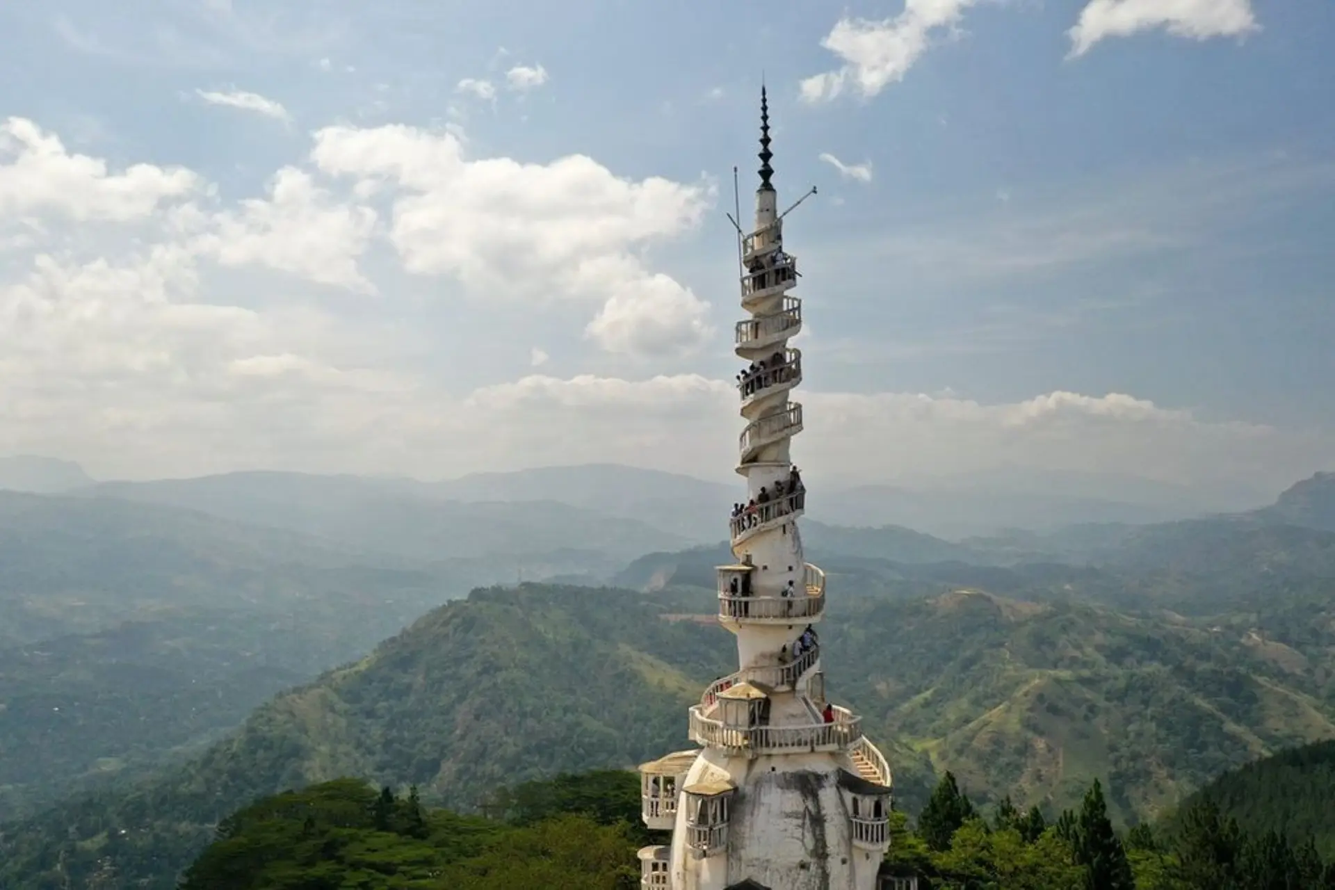 Ambulawa Tower spiraling up from green mountains