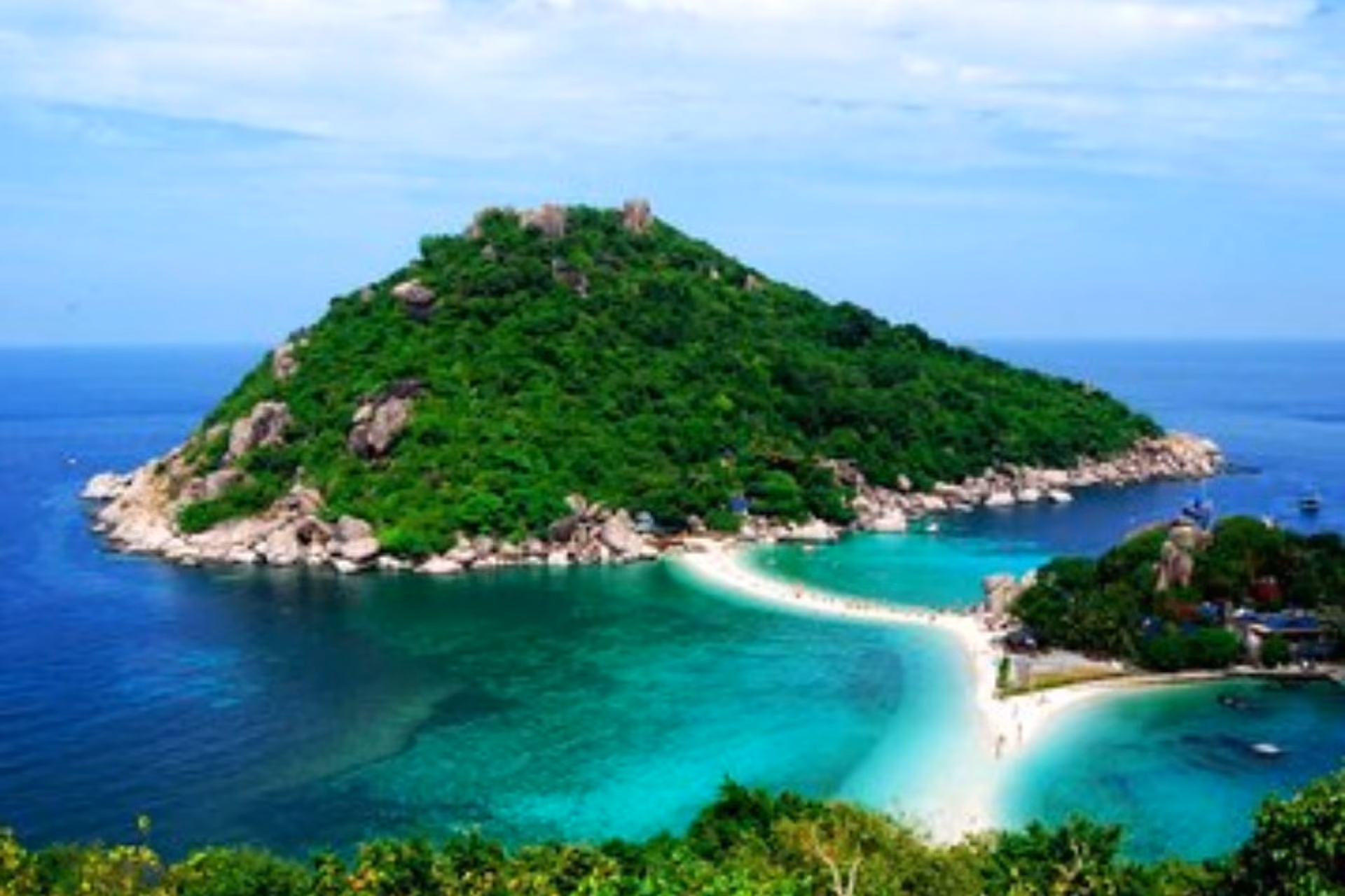 Nang Yuan island with green hills and white sand beach