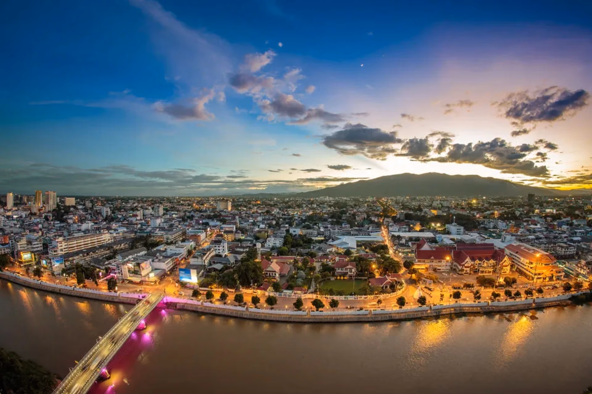 Chiang Mai city at sunset with river and mountain